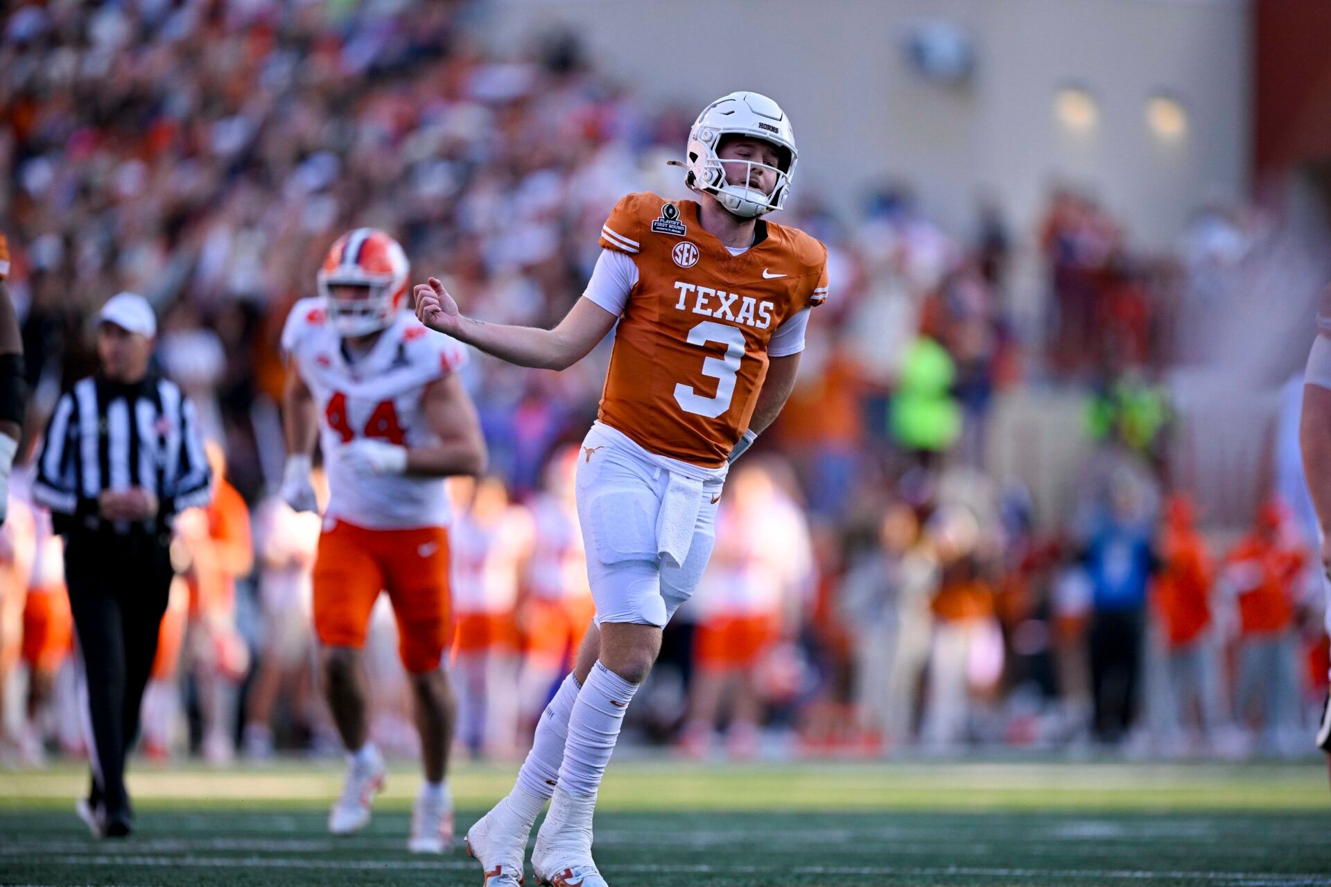 Texas Longhorns quarterback Quinn Ewers (3) celebrates after he throws a touchdown pass against the Clemson Tigers during the second quarter of the CFP National Playoff first round game at Darrell K Royal-Texas Memorial Stadium.