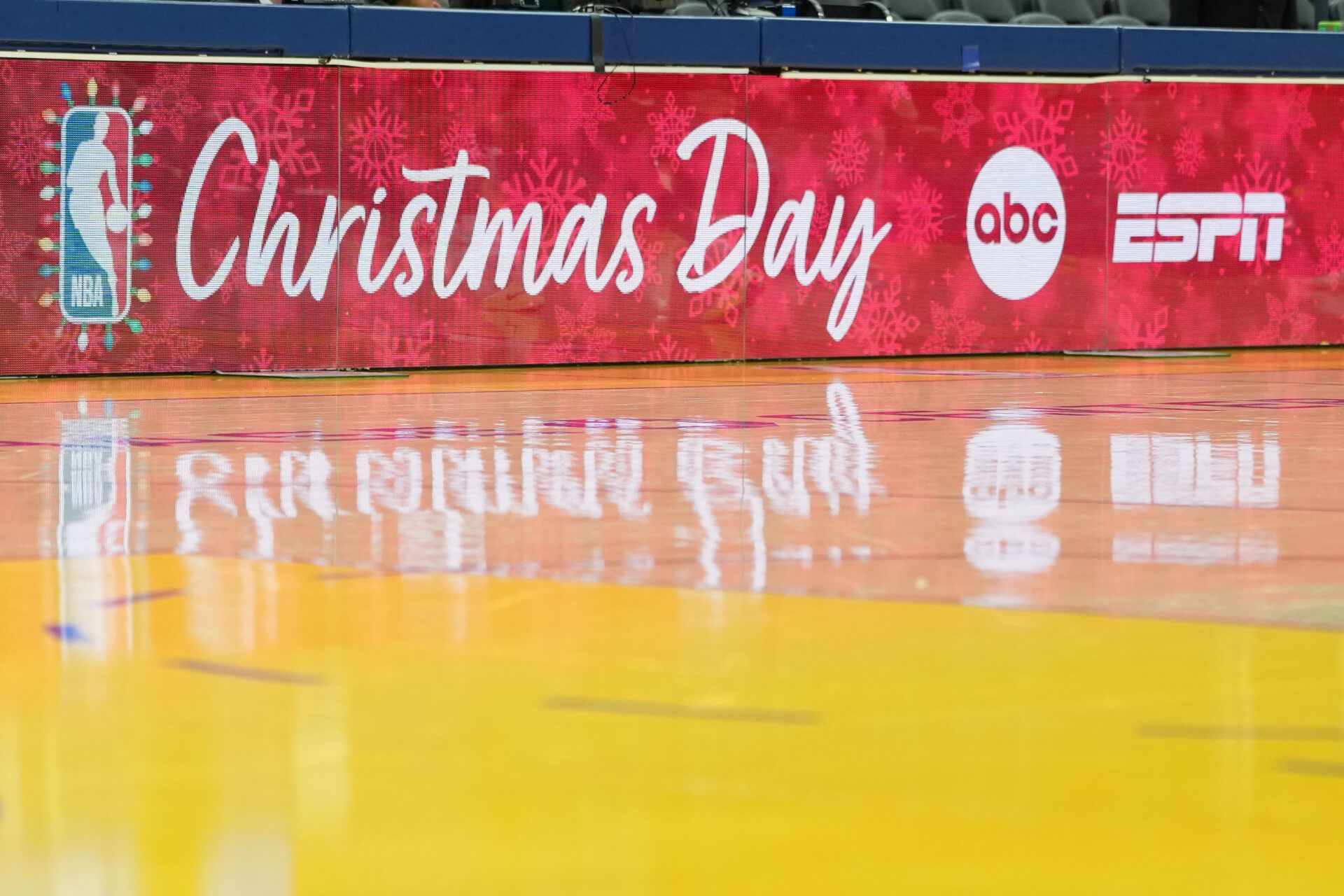 A courtside message board displays the NBA logo for Christmas before the game between the Golden State Warriors and the Dallas Mavericks at Chase Center.