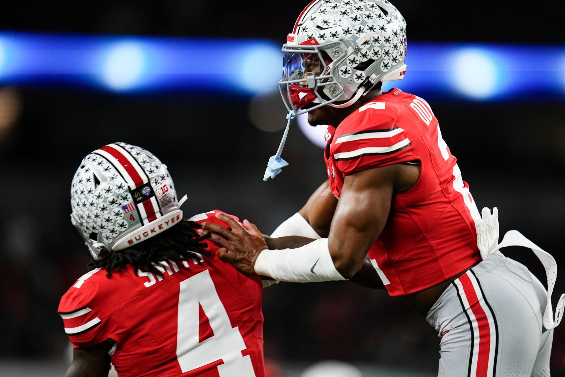 Ohio State Buckeyes defensive back Caleb Downs (2) celebrates with wide receiver Jeremiah Smith (4) during warm-ups prior to the Cotton Bowl at AT&T Stadium in Arlington, Texas for the College Football Playoff quarterfinal game against the Miami Hurricanes on Dec. 31, 2025.