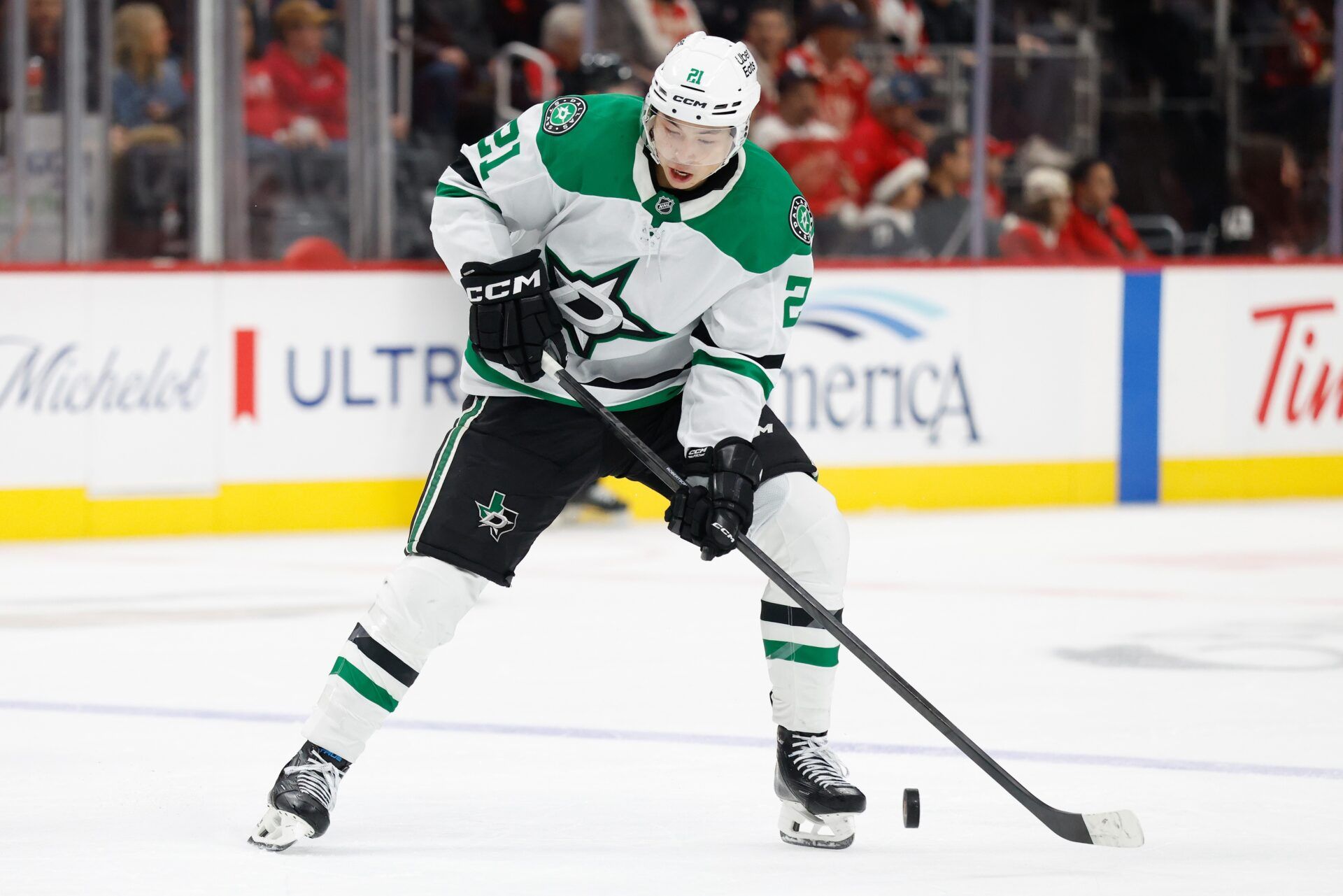 Dallas Stars left wing Jason Robertson (21) skates with the puck in the first period against the Detroit Red Wings at Little Caesars Arena.