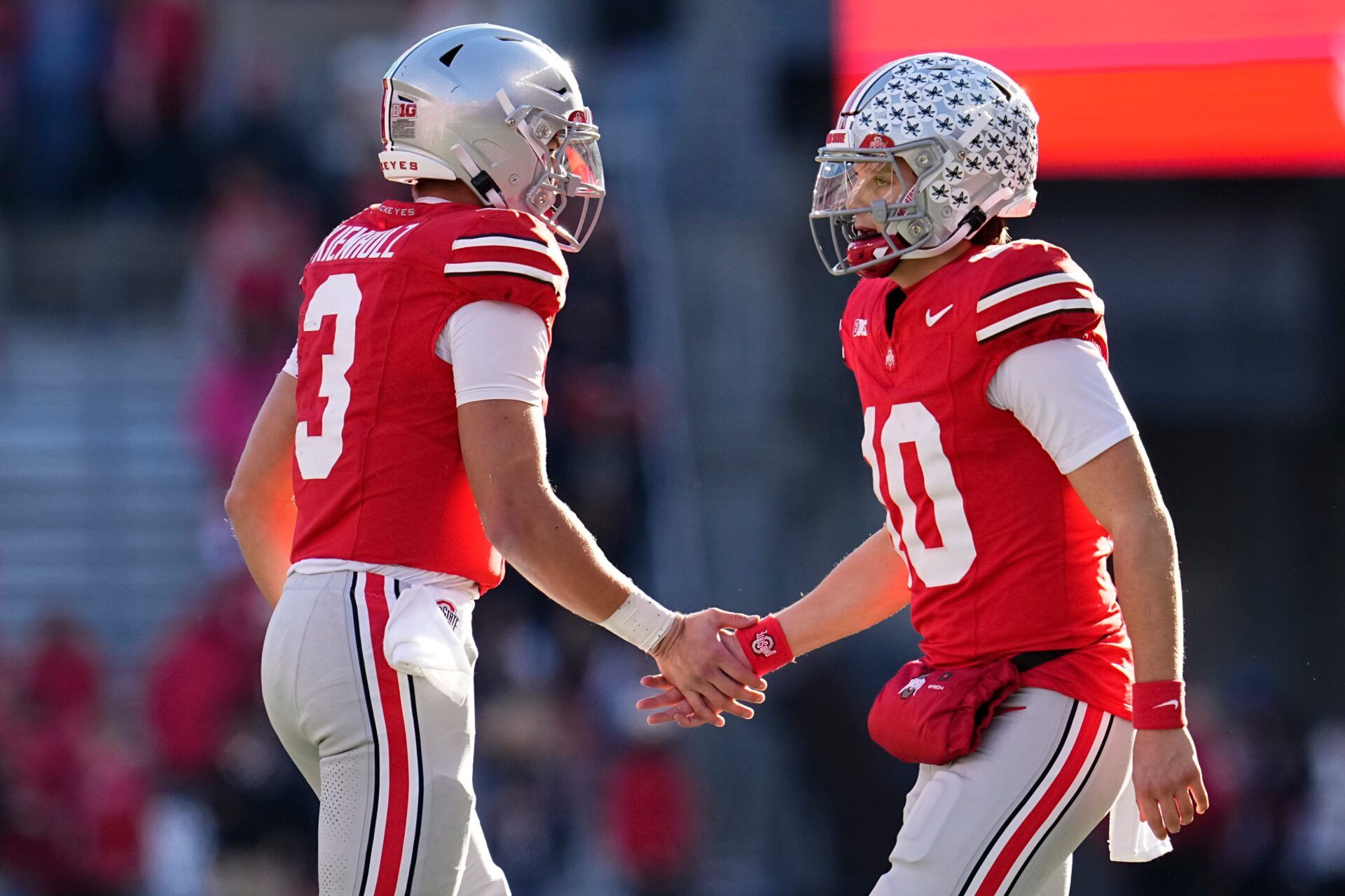 Ohio State Buckeyes quarterback Julian Sayin (10) subs in for quarterback Lincoln Kienholz (3) during the NCAA football game against the Rutgers Scarlet Knights at Ohio Stadium in Columbus on Nov. 22, 2025. Ohio State won 42-9.