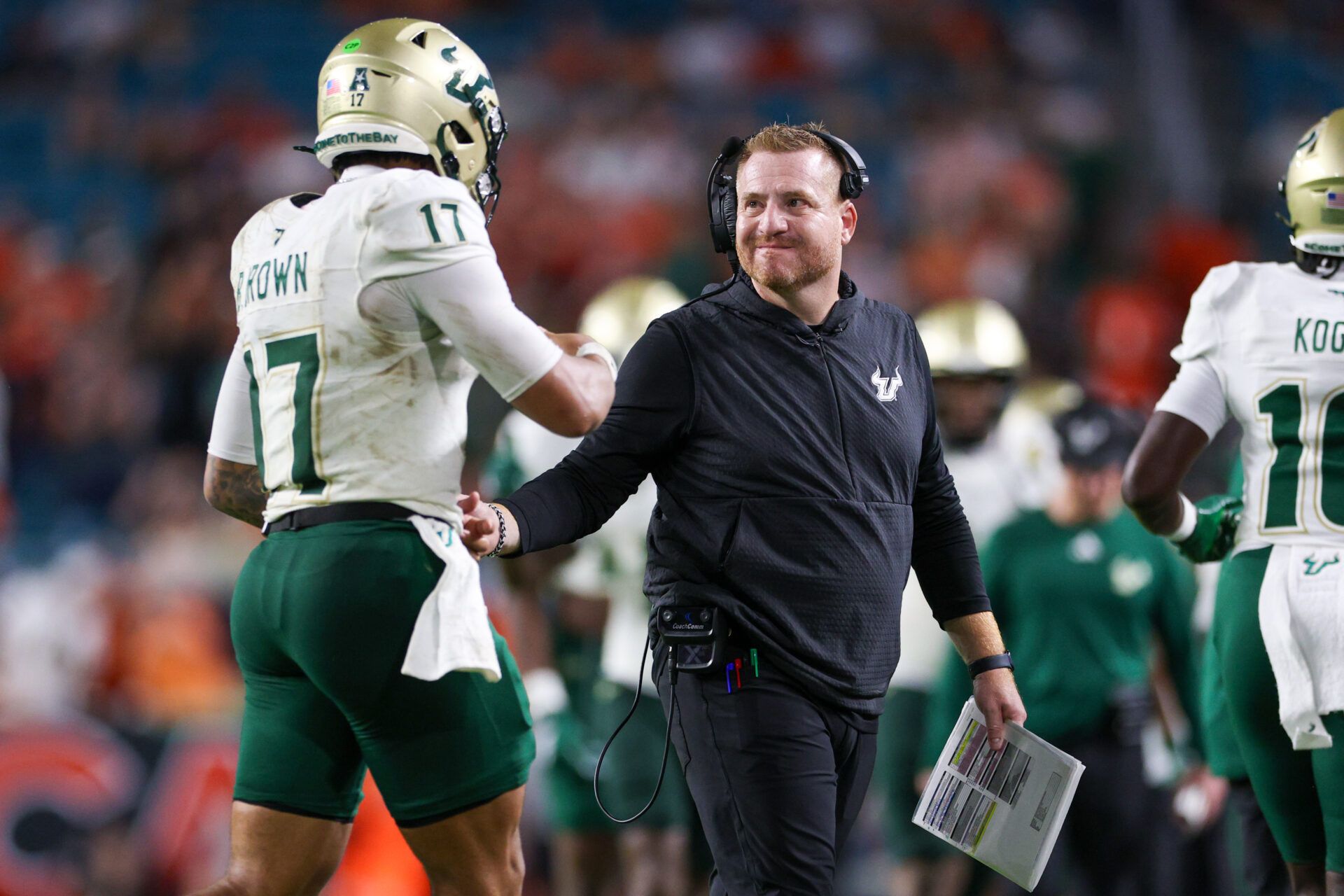 South Florida Bulls head coach Alex Golesh lreacts to a play with quarterback Byrum Brown (17) against the Miami Hurricanes in the third quarter at Hard Rock Stadium.
