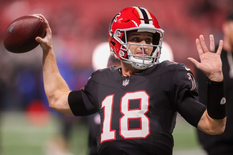Atlanta Falcons quarterback Kirk Cousins (18) warms up before a game against the Los Angeles Rams at Mercedes-Benz Stadium.