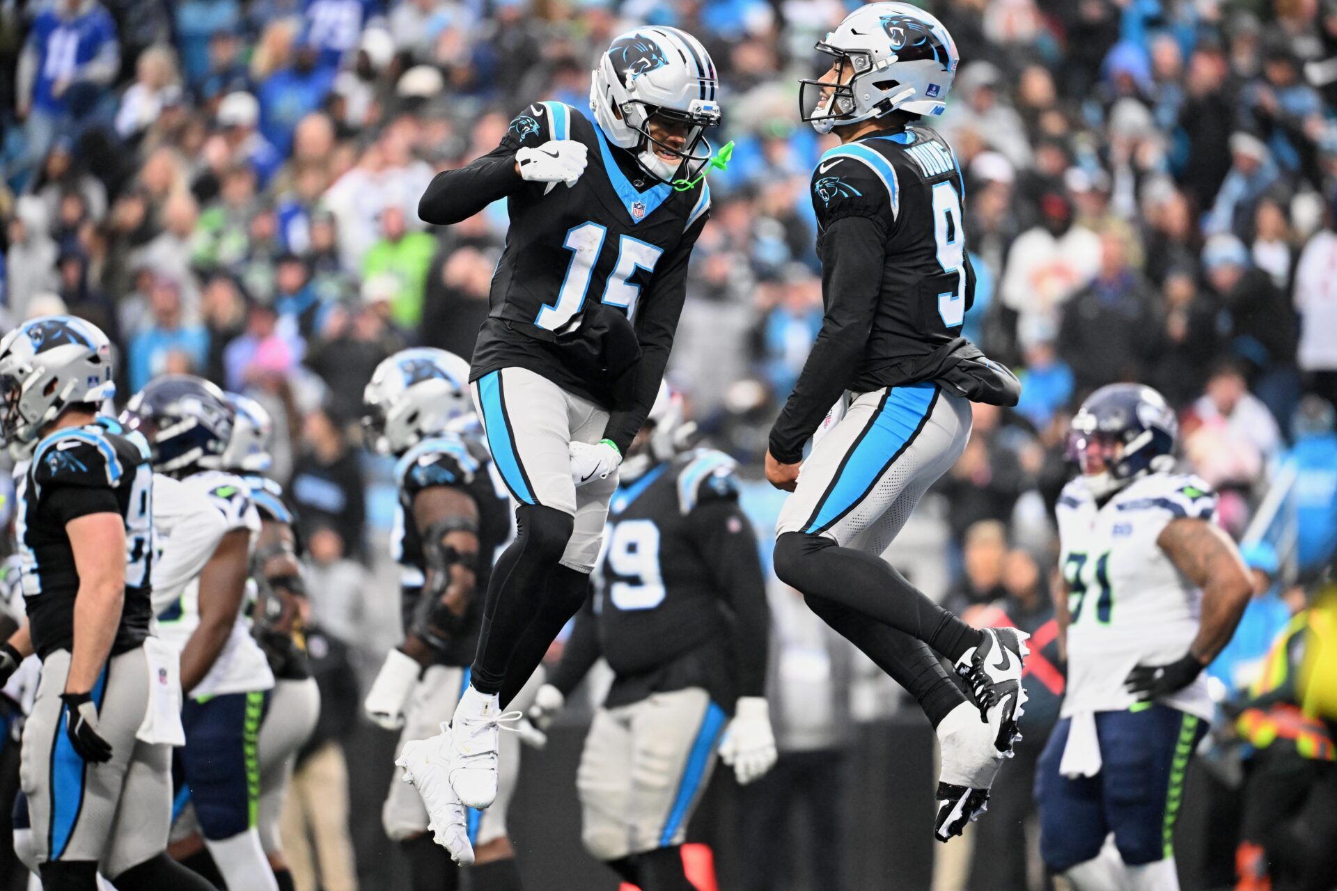 Carolina Panthers quarterback Bryce Young (9) leaps and celebrates with wide receiver Jimmy Horn Jr. (15) after scoring a scoring a touchdown against the Seattle Seahawks during the fourth quarter at Bank of America Stadium.