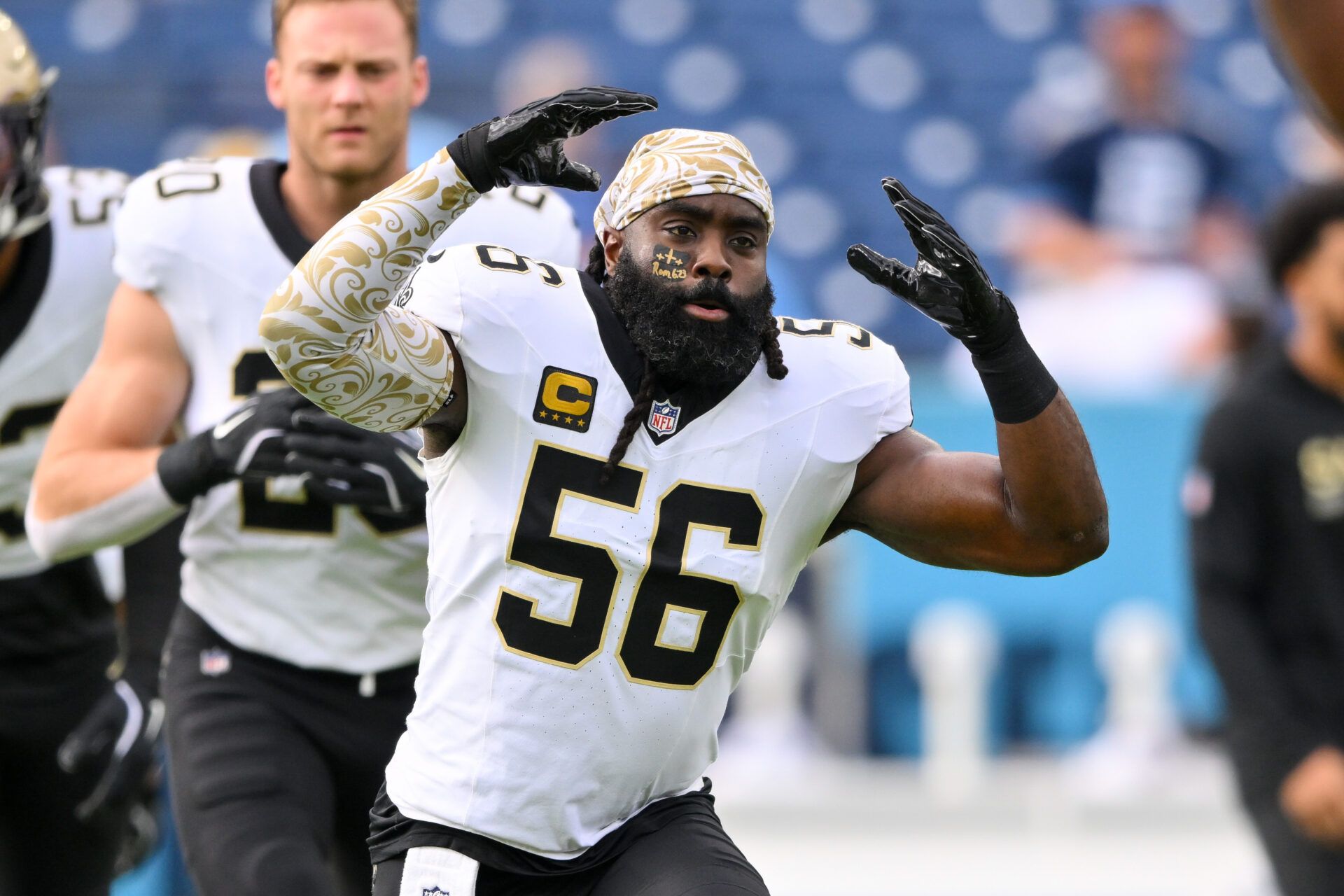 New Orleans Saints linebacker Demario Davis (56) stretches against the Tennessee Titans during pre-game warmups at Nissan Stadium.