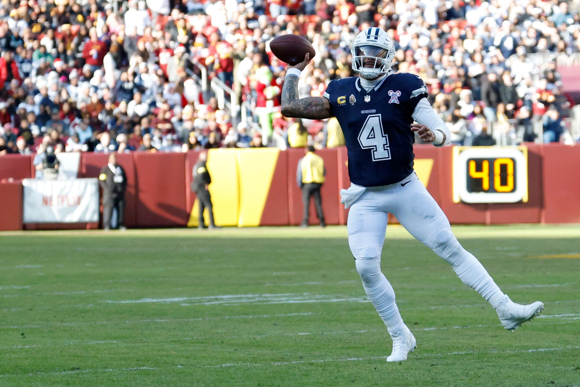 Dallas Cowboys quarterback Dak Prescott (4) touchback against the Washington Commanders during the first half at Northwest Stadium.