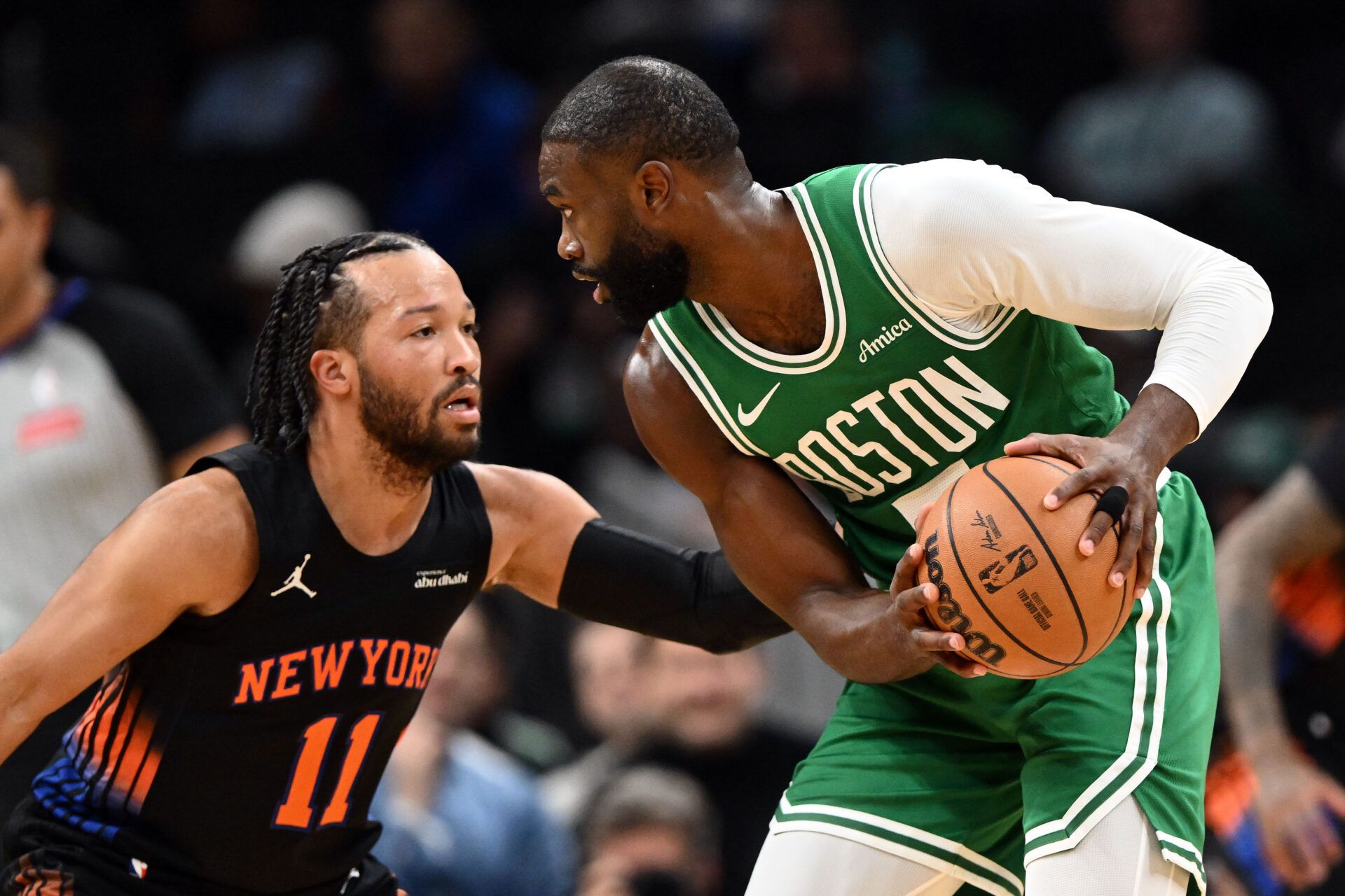 New York Knicks guard Jalen Brunson (11) defends Boston Celtics guard Jaylen Brown (7)  during the first half at the TD Garden.