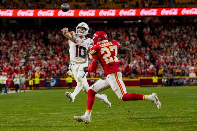 Denver Broncos quarterback Bo Nix (10) throws a toucdown pass during the fourth quarter at GEHA Field at Arrowhead Stadium.