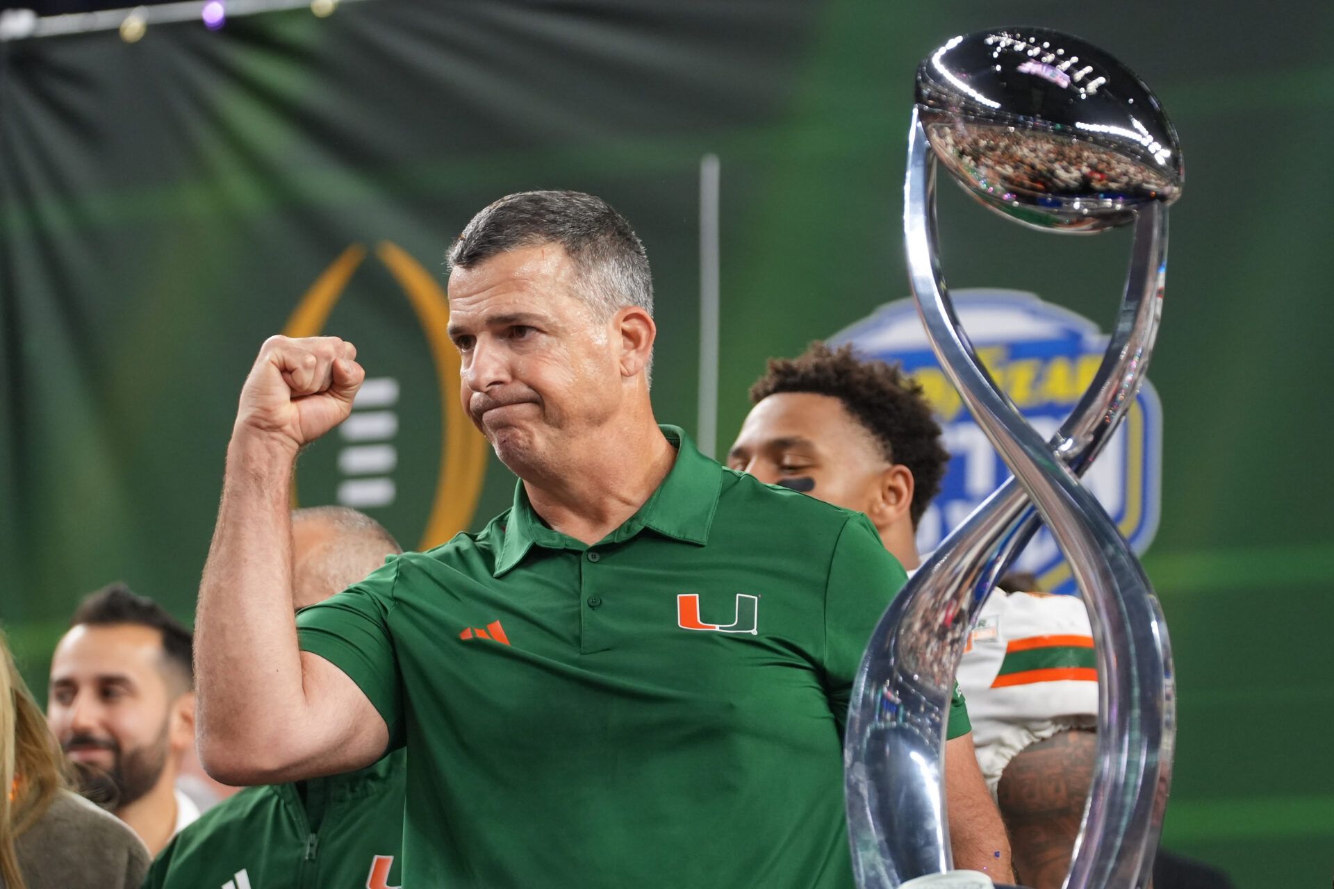 Miami Hurricanes head coach Mario Cristobal with the champions trophy following the 2025 Cotton Bowl and quarterfinal game of the College Football Playoff against the Ohio State Buckeyes at AT&T Stadium.
