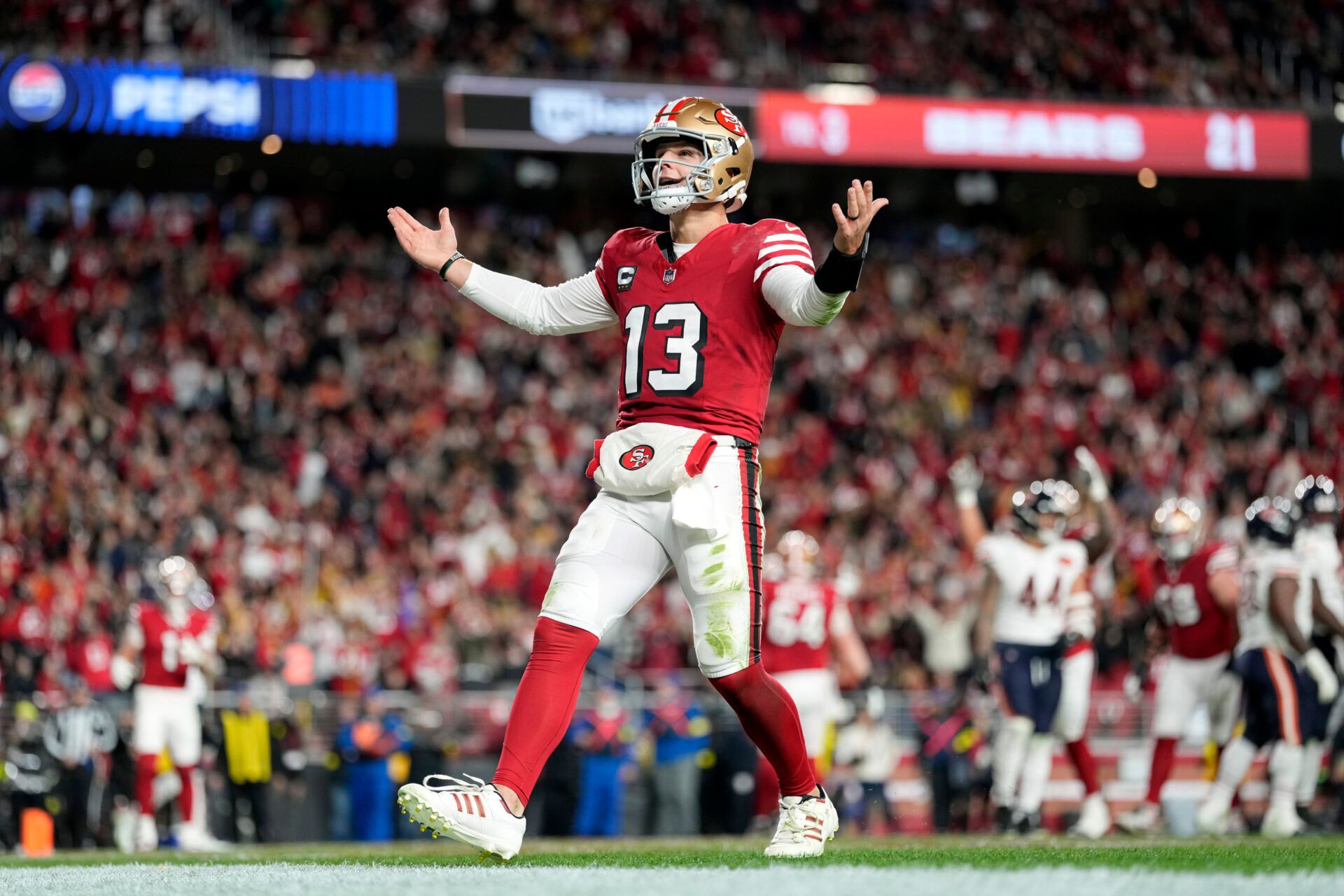 San Francisco 49ers quarterback Brock Purdy (13) celebrates after scoring a touchdown against the Chicago Bears in the first half at Levi's Stadium.