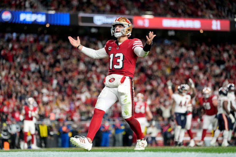 San Francisco 49ers quarterback Brock Purdy (13) celebrates after scoring a touchdown against the Chicago Bears in the first half at Levi's Stadium.