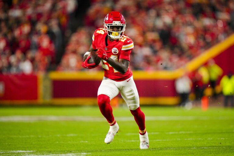 Kansas City Chiefs running back Brashard Smith (24) runs the ball during the first half against the Washington Commanders at GEHA Field at Arrowhead Stadium.