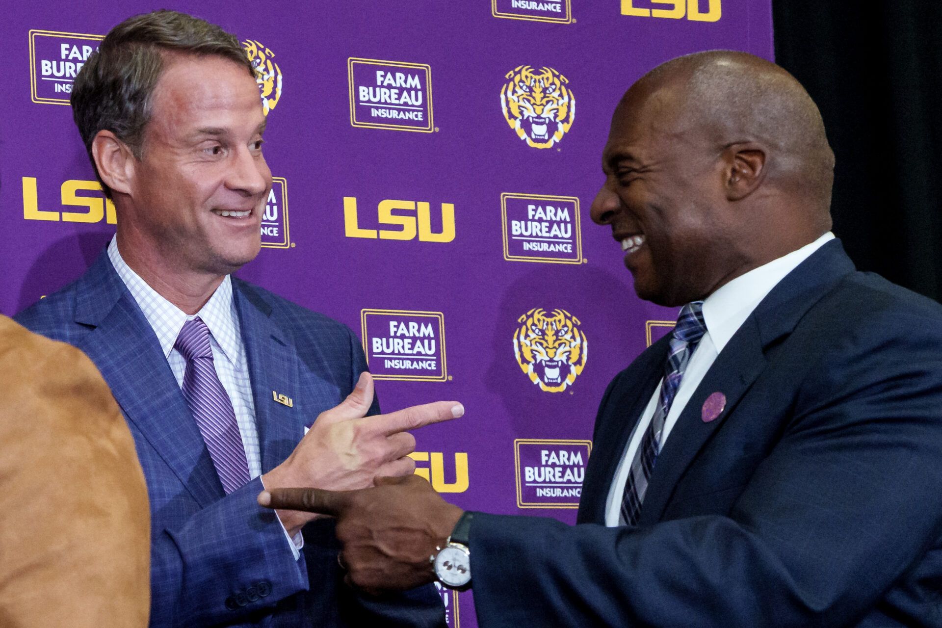 LSU new head coach Lane Kiffin, left, and LSU athletic director Verge Ausberry greet each other at South Stadium Club at Tiger Stadium.