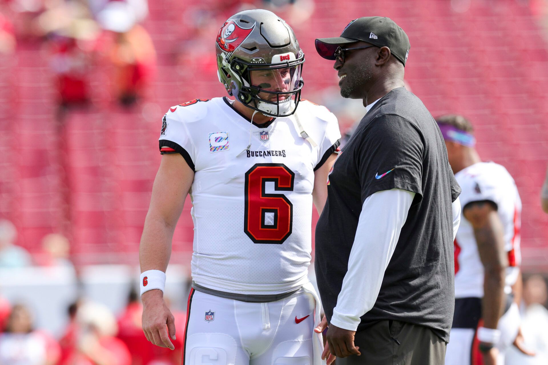 Tampa Bay Buccaneers quarterback Baker Mayfield (6) speaks to head coach Todd Bowles before a game against the Atlanta Falcons at Raymond James Stadium.