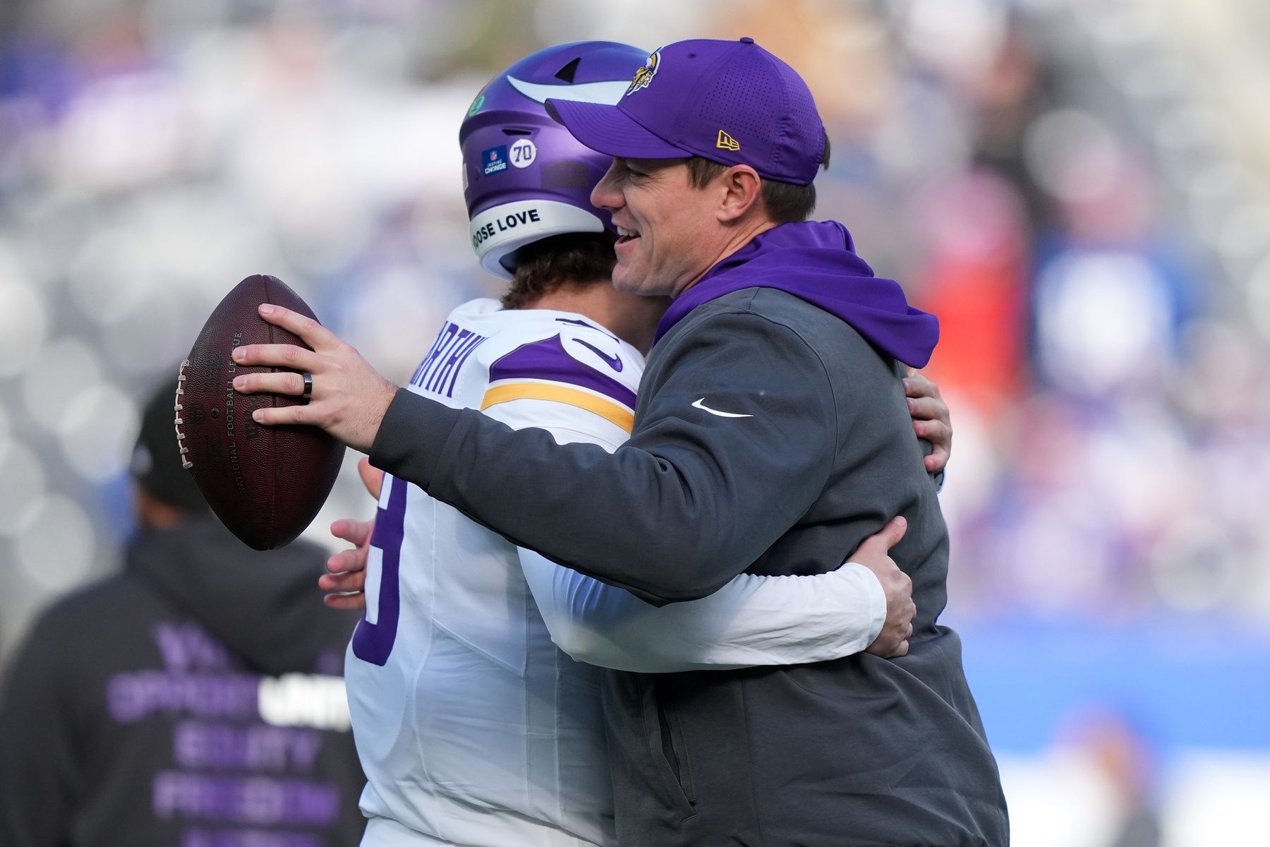 Minnesota Vikings quarterback J.J. McCarthy (9) and head coach Kevin O'Connell hug before the game at MetLife Stadium.