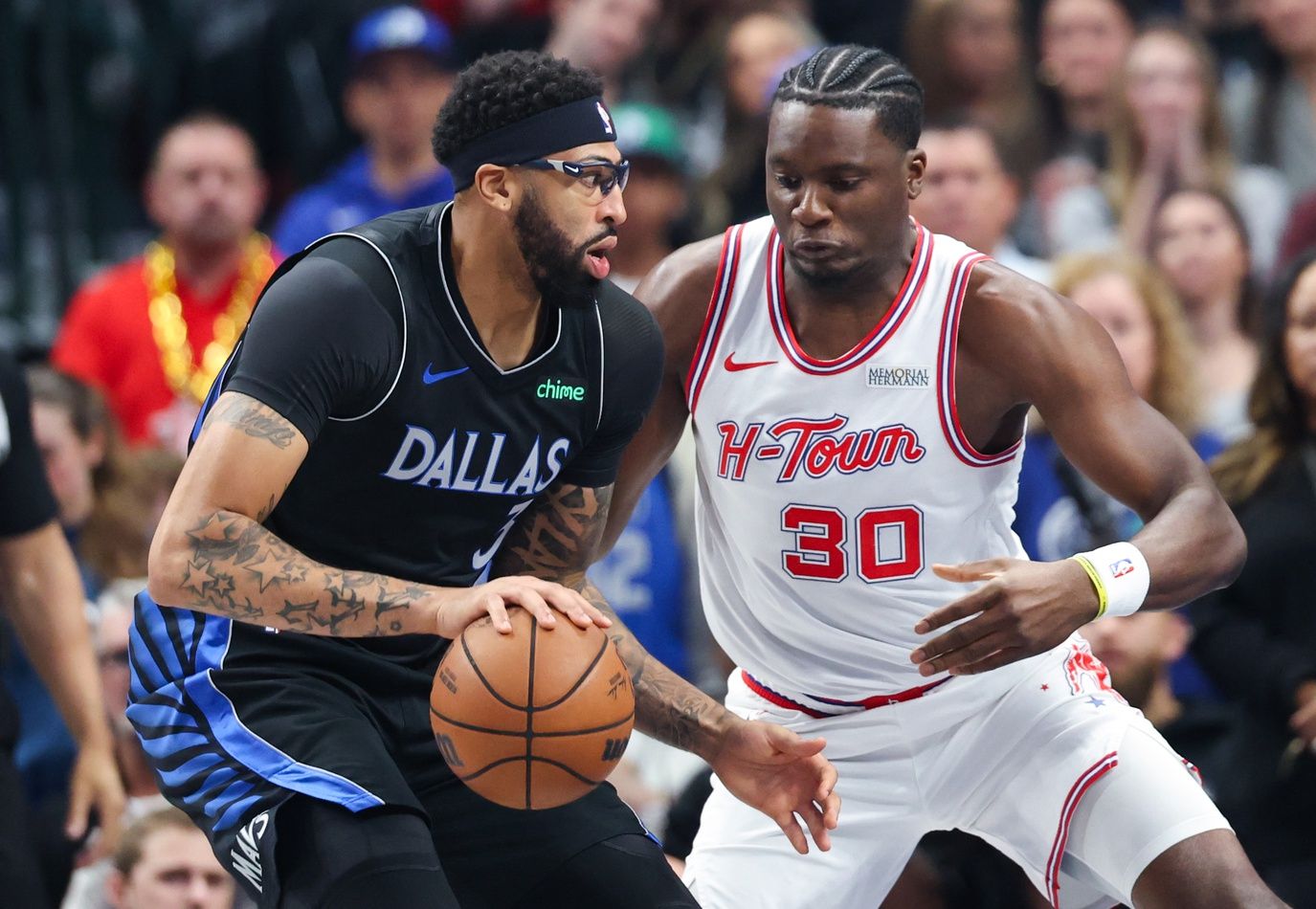 Dallas Mavericks forward Anthony Davis (3) drives to the basket as Houston Rockets center Clint Capela (30) defends during the first quarter at American Airlines Center.