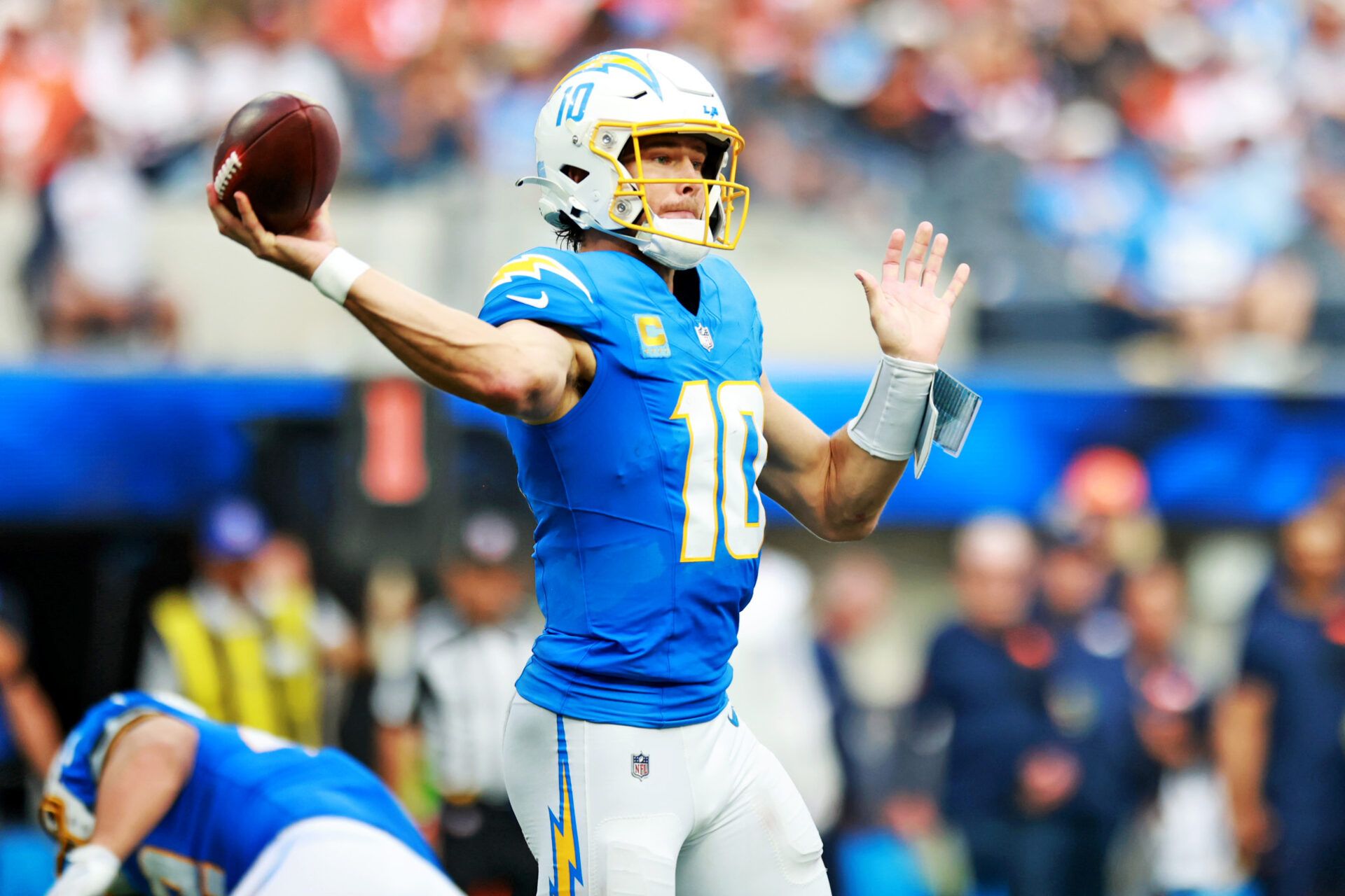 Los Angeles Chargers quarterback Justin Herbert (10) drops back for a pass during the second half against the Denver Broncos at SoFi Stadium.
