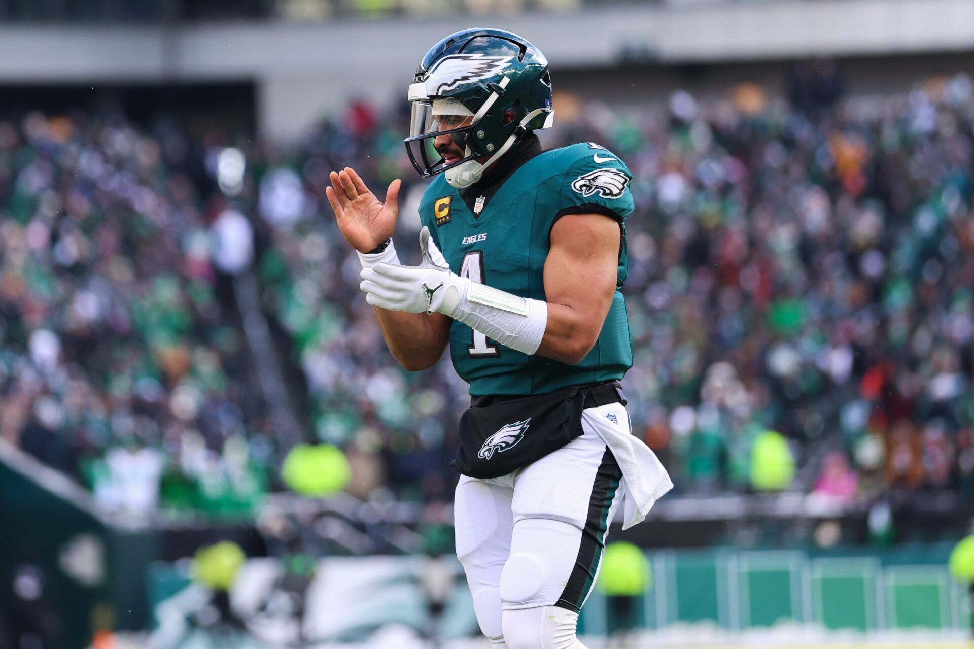 Philadelphia Eagles quarterback Jalen Hurts (1) reacts after running back Saquon Barkley (26) (not pictured) scores a touchdown against the Las Vegas Raiders during the second quarter at Lincoln Financial Field.