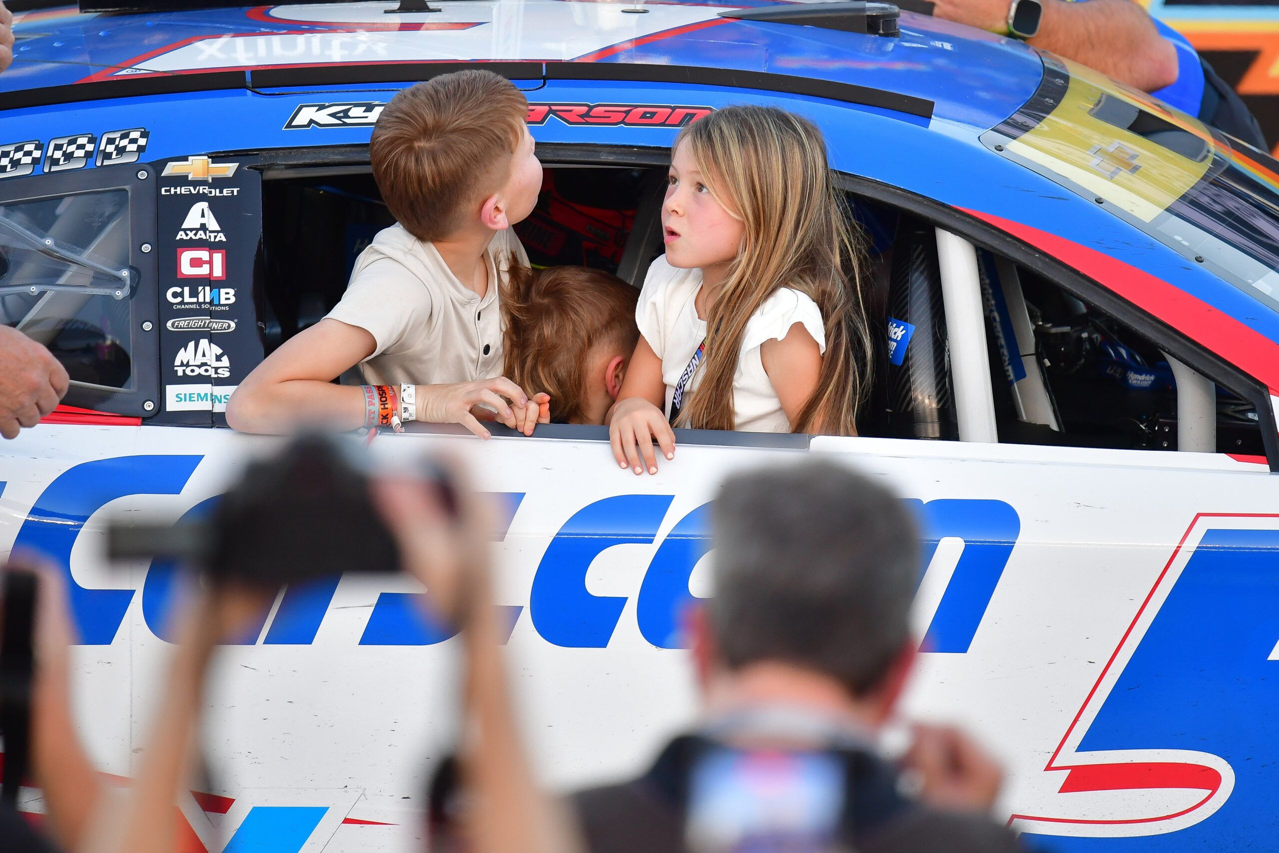 The children of NASCAR Cup Series driver Kyle Larson (5) following the Cup Series Championship race at Phoenix Raceway.