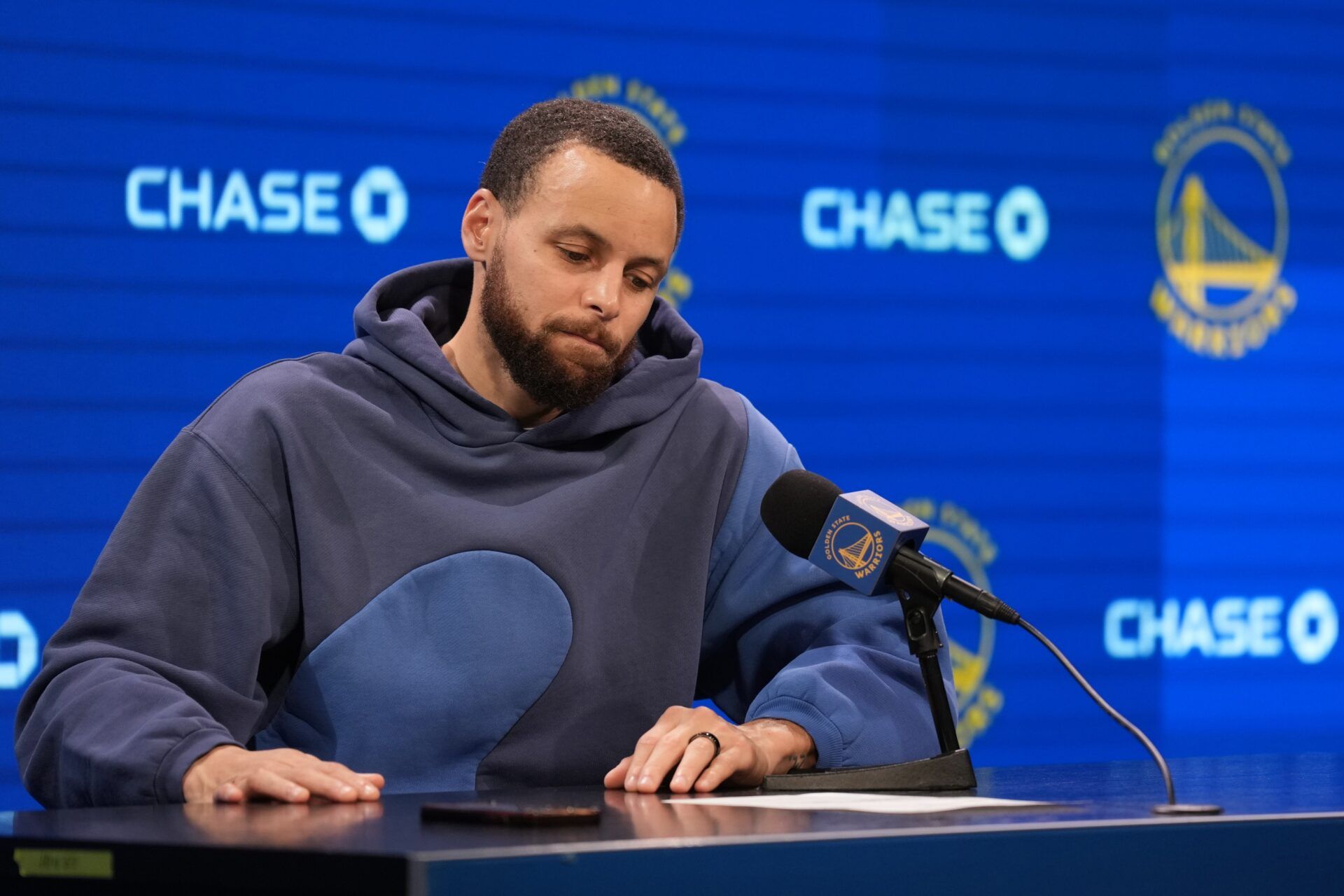 Golden State Warriors guard Stephen Curry (30) reads the stat sheet while talking to media members after the game against the Los Angeles Lakers at Chase Center.
