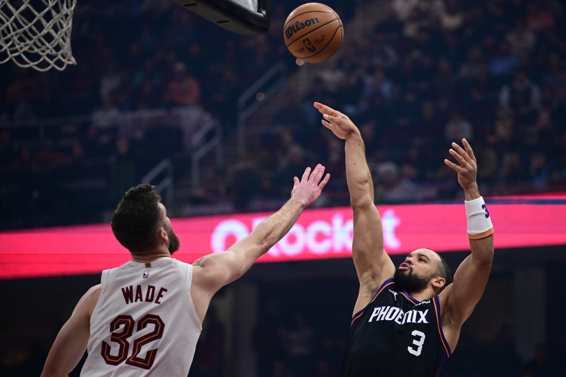 Phoenix Suns forward Dillon Brooks (3) shoots over Cleveland Cavaliers forward Dean Wade (32) during the first half at Rocket Arena.