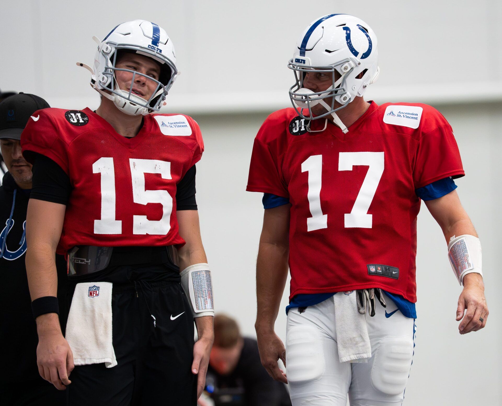 Indianapolis Colts quarterbacks Philip Rivers (17) and Riley Leonard (15) talk Wednesday, Dec. 10, 2025, during practice at the Colts training facility in Indianapolis.