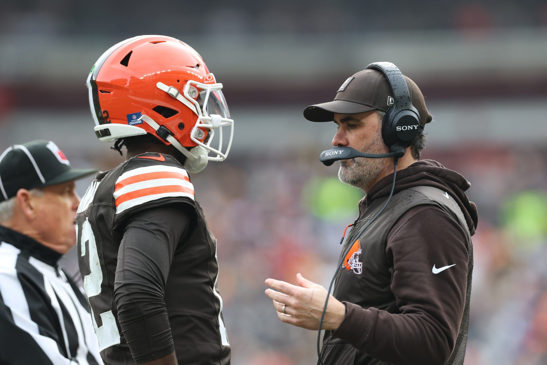 Cleveland Browns head coach Kevin Stefanski speaks with quarterback Shedeur Sanders (12) during a time out in the second quarter against the Pittsburgh Steelers at Huntington Bank Field.