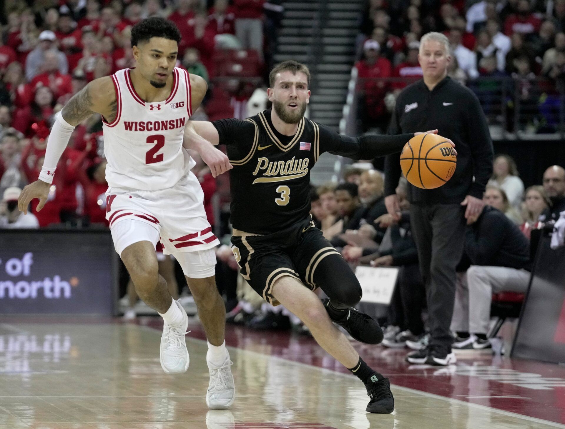 Purdue guard Braden Smith (3) drives past Wisconsin guard Nick Boyd (2) during the first half of their game Saturday, January 3, 2026 at the Kohl Center in Madison, Wisconsin.