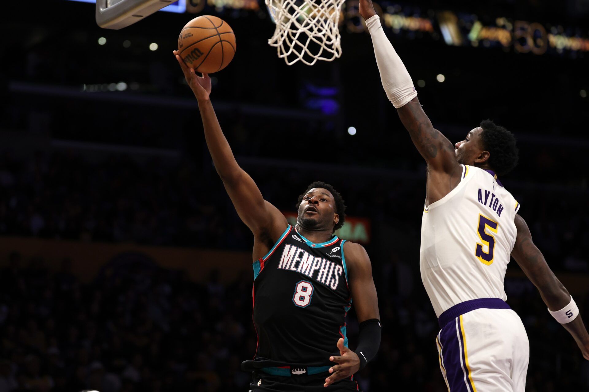 Memphis Grizzlies forward Jaren Jackson Jr. (8) shoots a layup against Los Angeles Lakers center Deandre Ayton (5) during the fourth quarter at Crypto.com Arena.