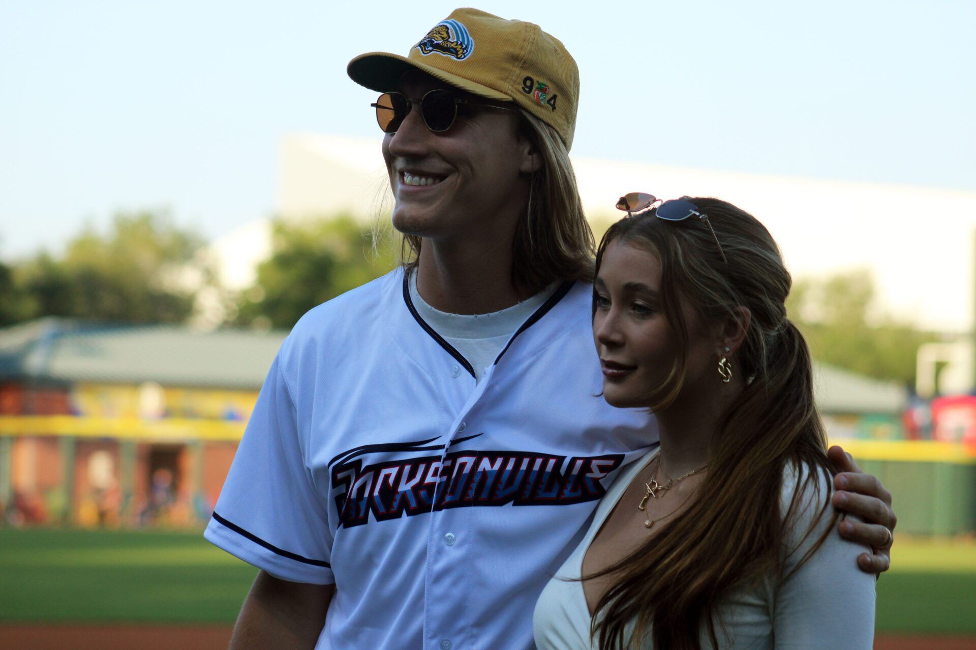Jaguars quarterback Trevor Lawrence and his wife, Marissa, pose for fans after his ceremonial first pitch before the Jacksonville Jumbo Shrimp's Triple-A baseball home opener against Durham on April 4, 2023. [Clayton Freeman/Florida Times-Union]