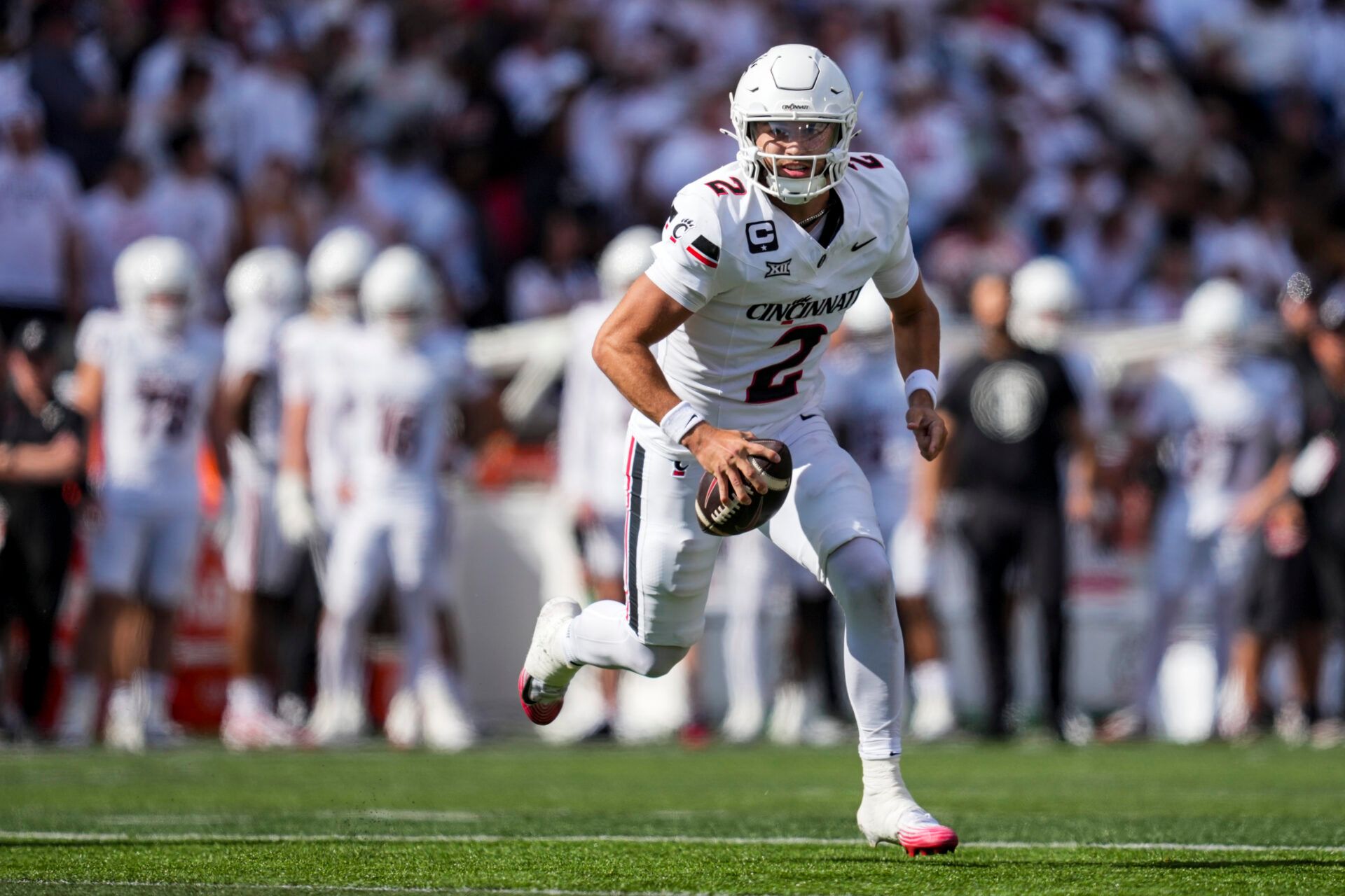 Cincinnati Bearcats quarterback Brendan Sorsby (2) runs with the ball as he looks to pass against the Bowling Green Falcons in the first half at Nippert Stadium.