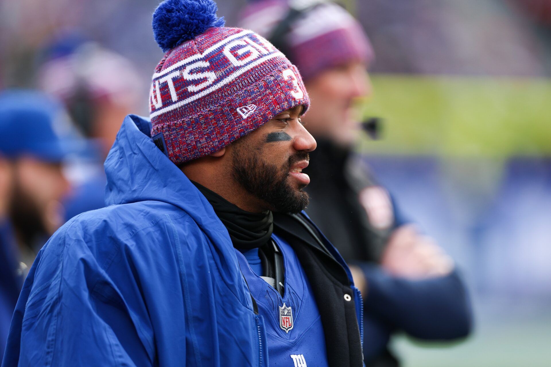 New York Giants quarterback Russell Wilson (3) looks on from the sideline during the first quarter against the Dallas Cowboys at MetLife Stadium.