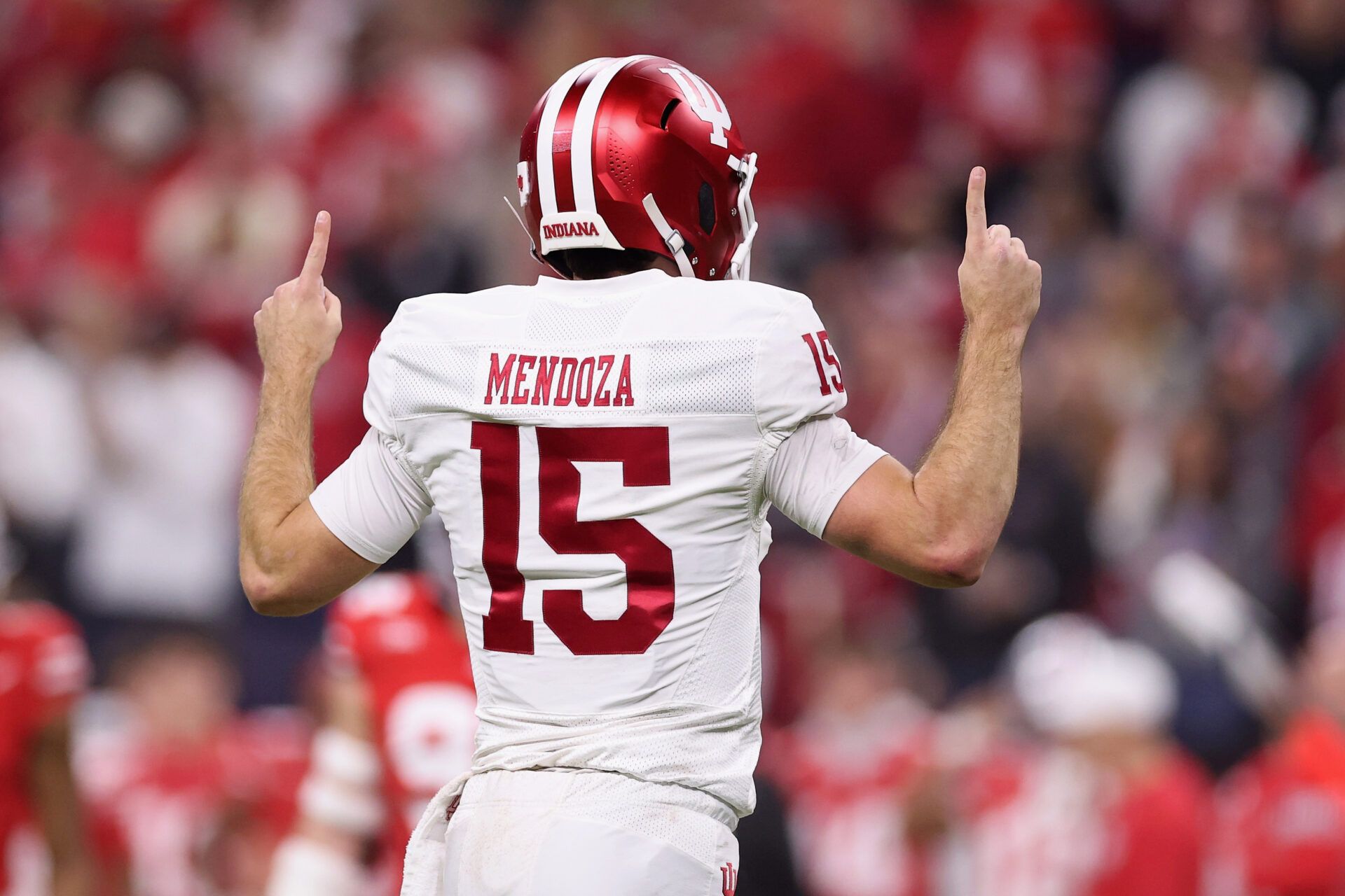 INDIANAPOLIS, INDIANA - DECEMBER 06: Fernando Mendoza #15 of the Indiana Hoosiers reacts as he runs onto the field against the Ohio State Buckeyes during the first quarter in the 2025 Big Ten Football Championship at Lucas Oil Stadium on December 06, 2025 in Indianapolis, Indiana.  (Photo by Michael Reaves/Getty Images)