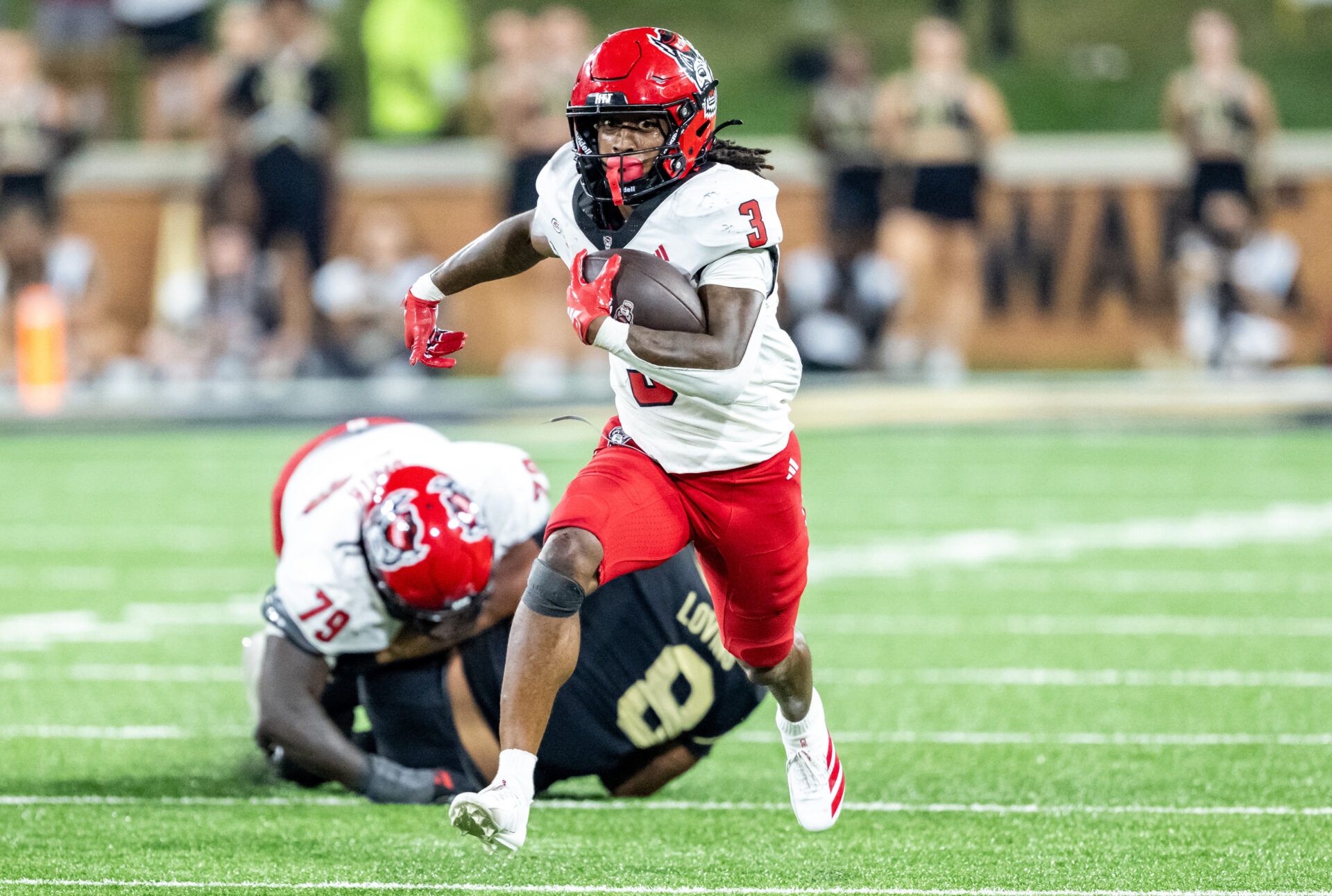 North Carolina State Wolfpack running back Hollywood Smothers (3) runs the ball in the first half against the Wake Forest Demon Deacons at Allegacy Federal Credit Union Stadium.