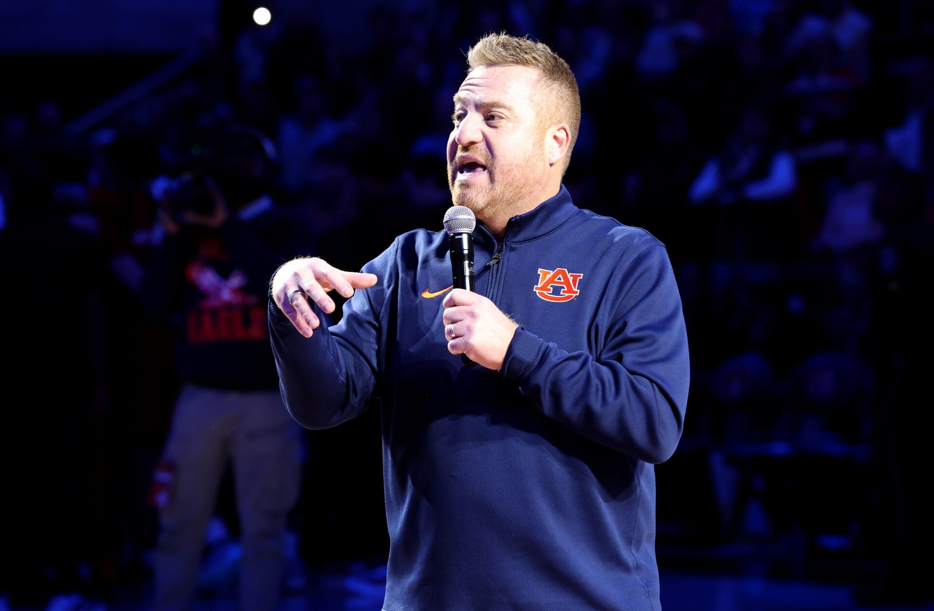 Auburn Tigers head football coach Alex Golesh is introduced during the first half of a basketball game between the Auburn Tigers and NC State Wolfpack at Neville Arena.