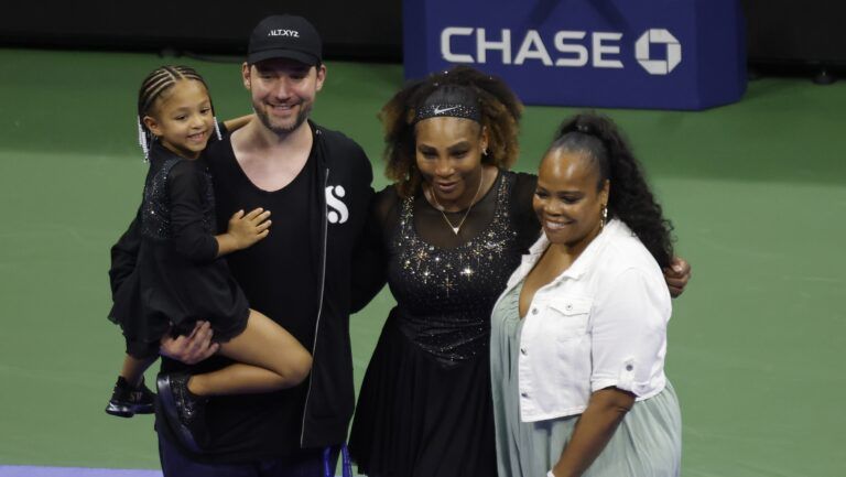Serena Williams (USA) (M-L) poses for a picture with daughter Olympia (L), husband Alexis Ohanian (M-L), and sister Isha Price (R) after a ceremony honoring her career after her match against Danka Kovinic (MNE) (not pictured) on day one of the 2022 U.S. Open tennis tournament at USTA Billie Jean King National Tennis Center.