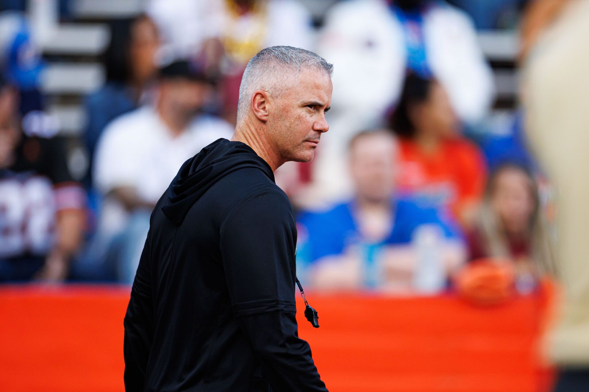 Florida State Seminoles head coach Mike Norvell walks on the field before a game against the Florida Gators at Ben Hill Griffin Stadium.