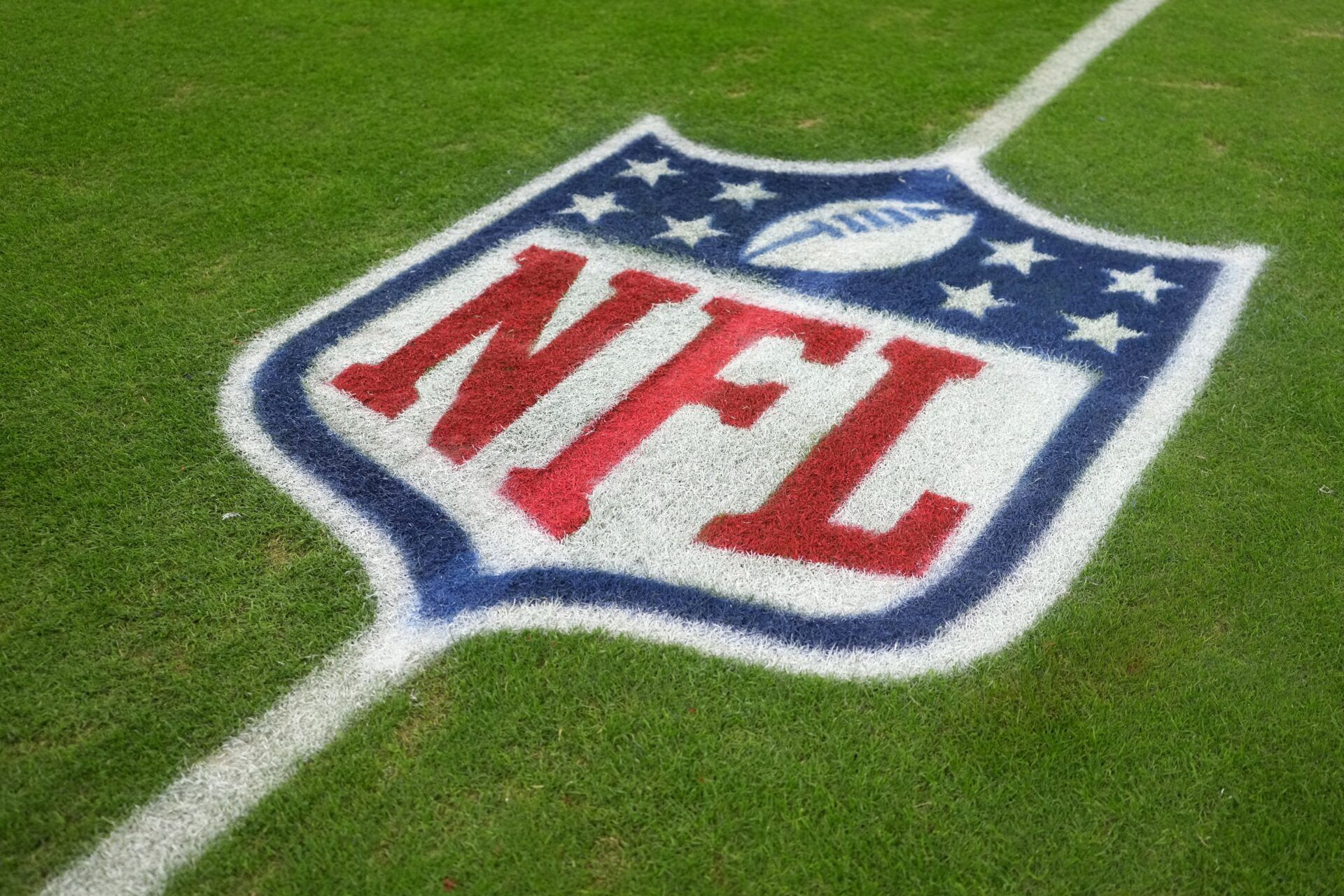 The NFL shield logo on the field at Allegiant Stadium.