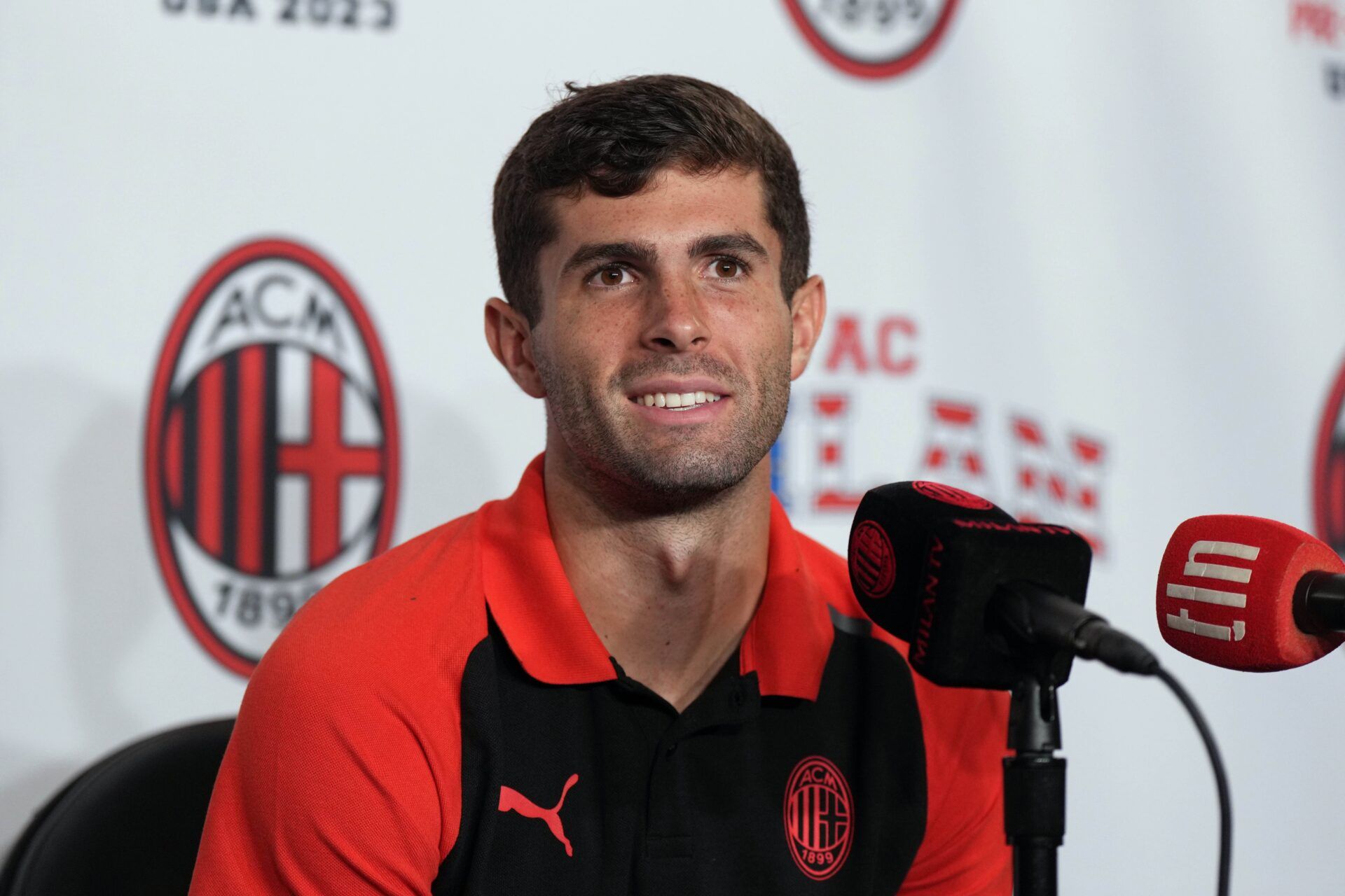 AC Milan midfielder Christian Pulisic speaks at a press conference at BMO Stadium.