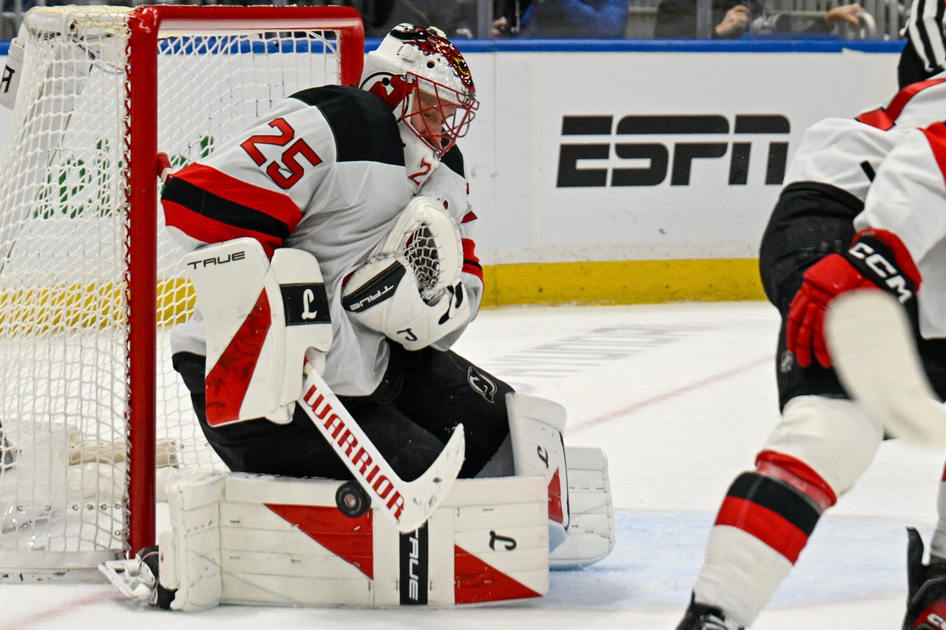 New Jersey Devils goaltender Jacob Markstrom (25) makes a save against the New York Islanders during the second period at UBS Arena.