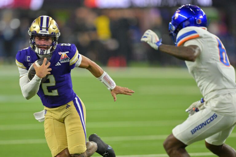 Washington Huskies quarterback Demond Williams Jr. (2) is forced out of bounds by Boise State Broncos defensive back Jeremiah Earby (6) after a catching a pass in the second half of the LA Bowl at SoFi Stadium.