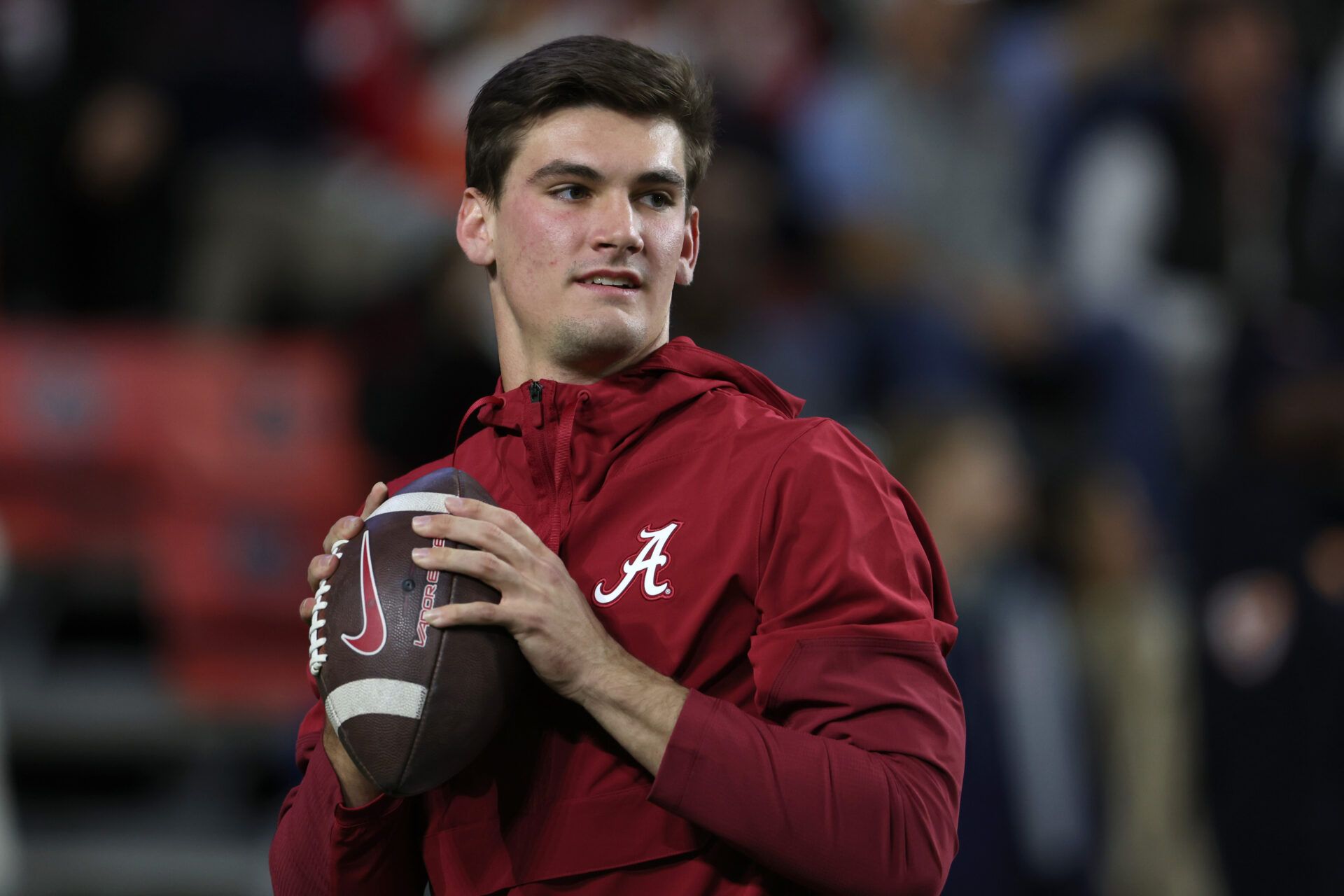 Alabama Crimson Tide quarterback Ty Simpson (15) warms up before the game against the Auburn Tigers at Jordan-Hare Stadium.