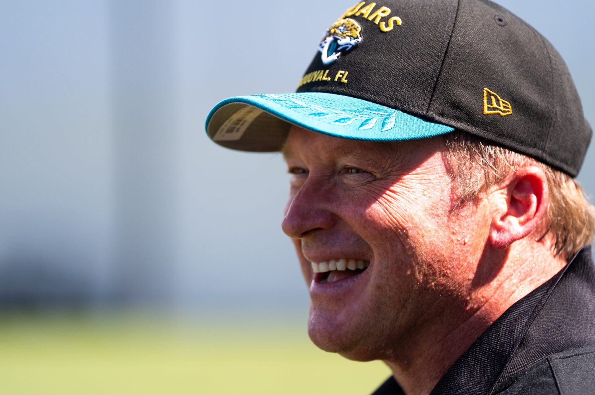 Former NFL Coache Jon Gruden have a laugh while attending an NFL training camp session ten at the Miller Electric Center, Tuesday, Aug. 5, 2025, in Jacksonville, Fla. [Doug Engle/Florida Times-Union]