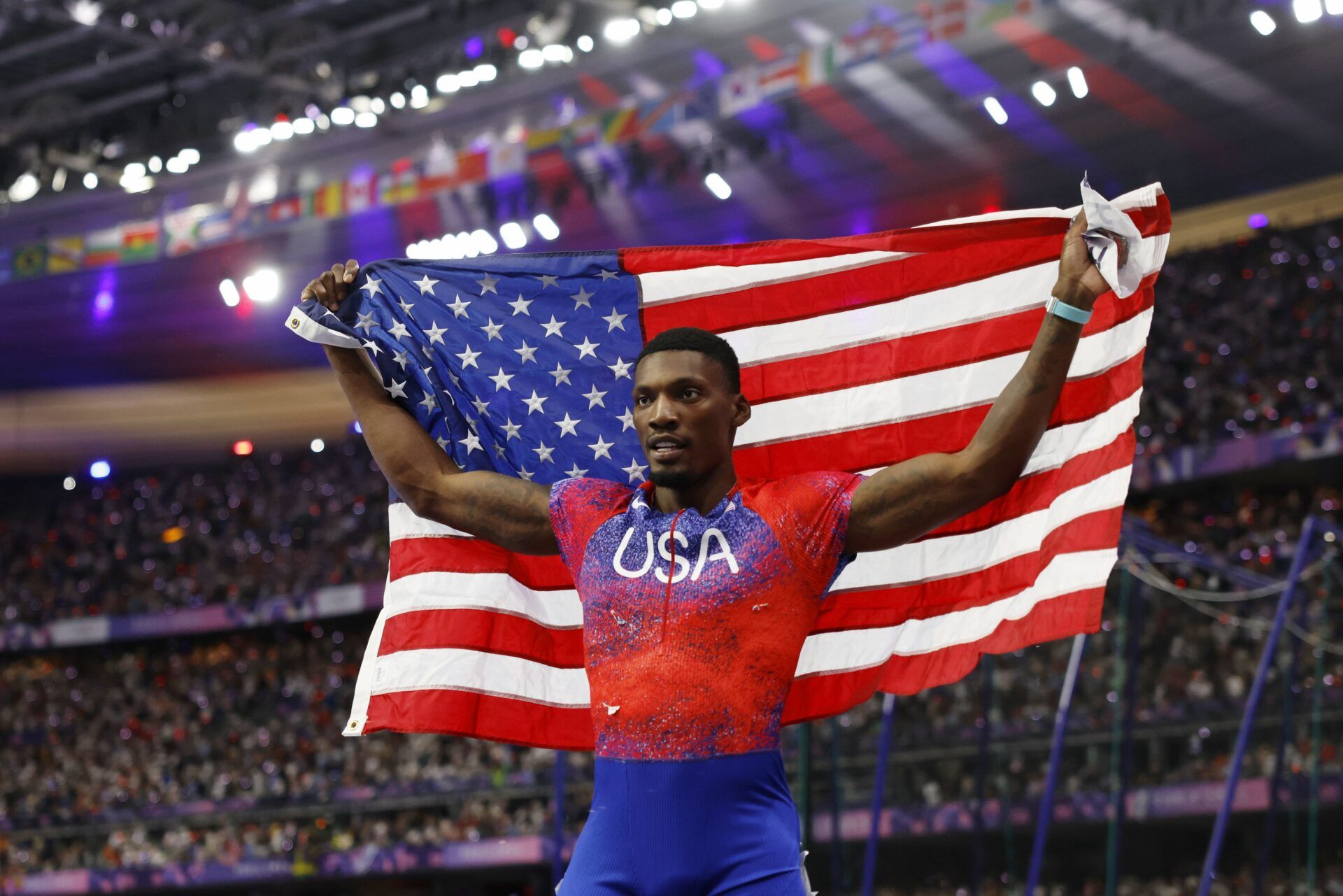 Fred Kerley (USA) celebrates after winning bronze in the mens 100m final during the Paris 2024 Olympic Summer Games at Stade de France.