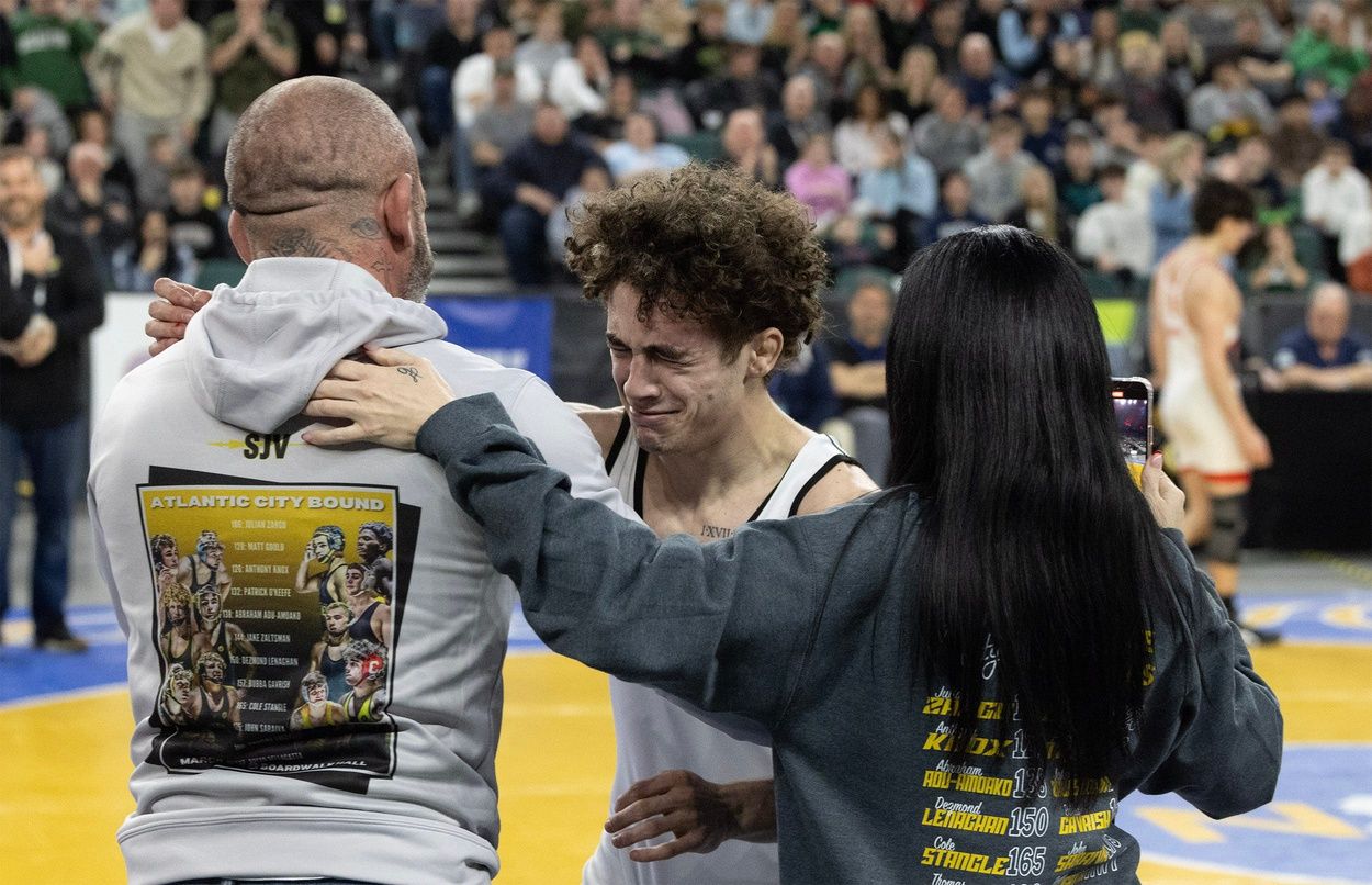 Knox hugs his parents after win. SJV’s Anthony Knox vs Bergen Catholic’s Nathan Braun in their 126 lbs. State Westling Championships in Atlantic City on March 8, 2025.