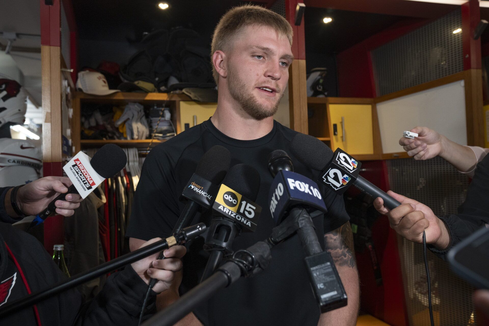 Trey McBride talks with the media in the locker room at Dignity Health Arizona Cardinals Training Center in Tempe on Jan. 5, 2026.