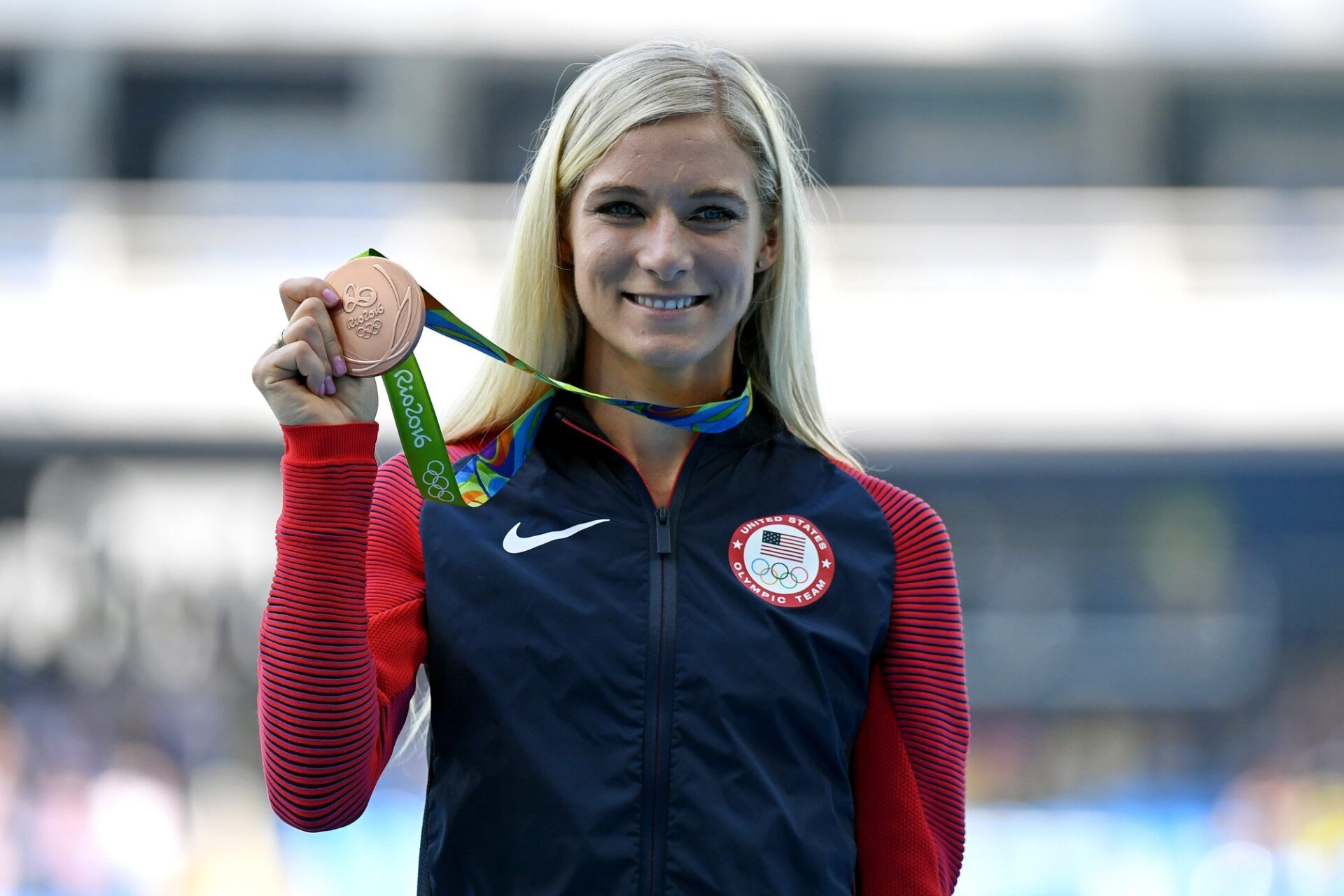 Emma Coburn (USA) celebrates winning the bronze medal during the women's 3000m steeplechase final in the Rio 2016 Summer Olympic Games at Estadio Olimpico Joao Havelange.