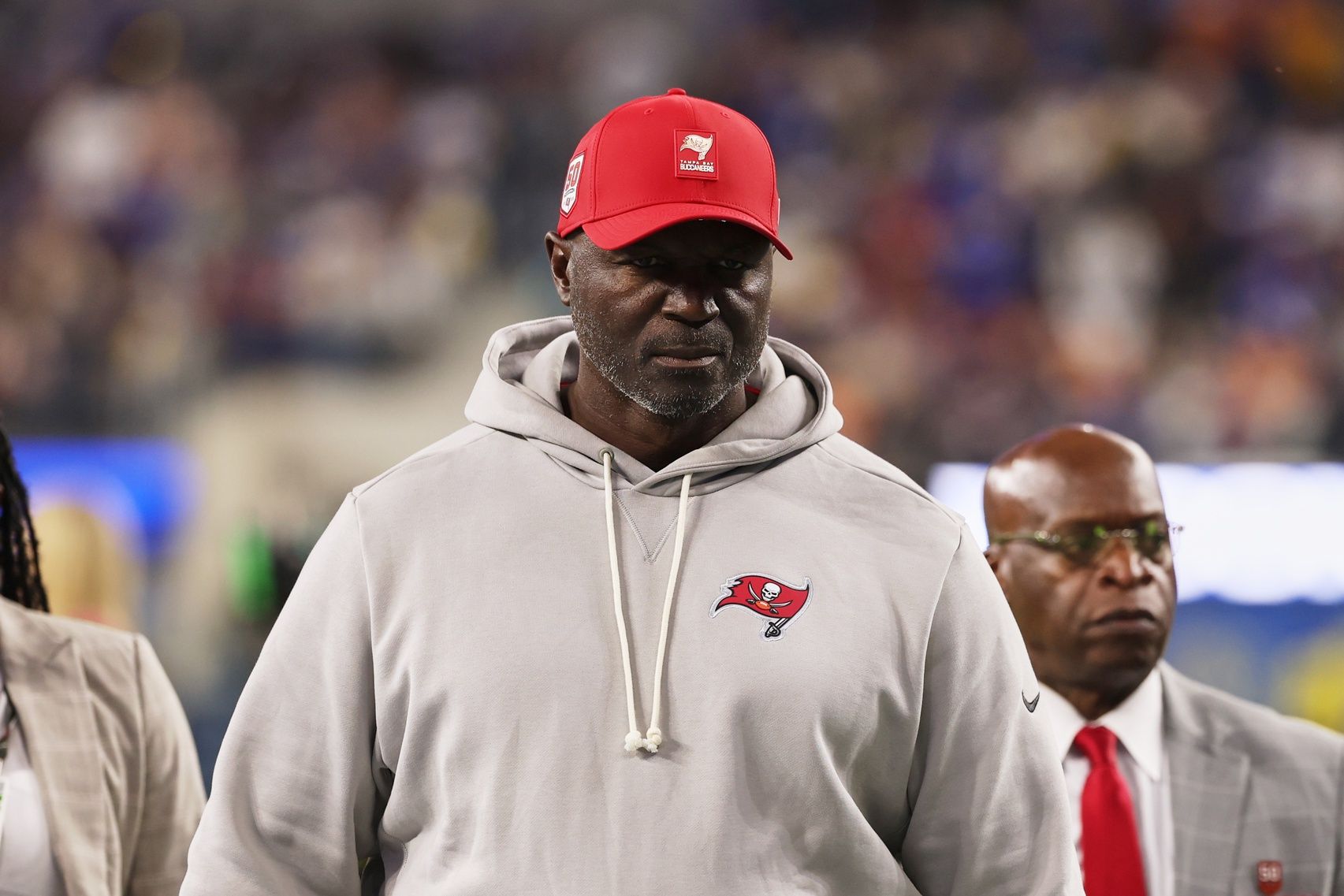 Tampa Bay Buccaneers head coach and defensive coordinator Todd Bowles walks off the field during halftime against the Los Angeles Rams at SoFi Stadium.