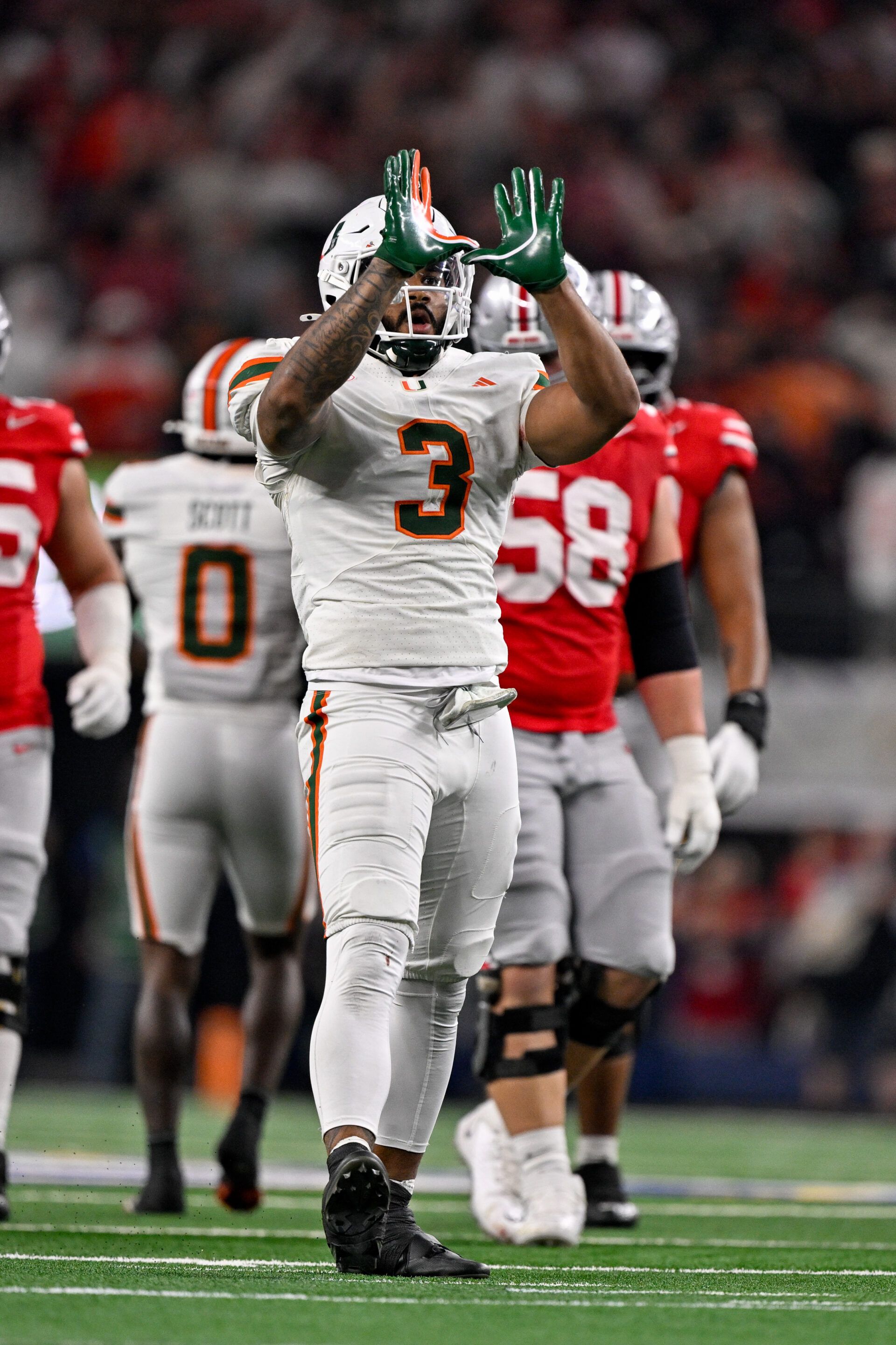 Miami Hurricanes defensive lineman Akheem Mesidor (3) celebrates after he sacks Ohio State Buckeyes quarterback Julian Sayin (not pictured) during the 2025 Cotton Bowl and quarterfinal game of the College Football Playoff at AT&T Stadium.