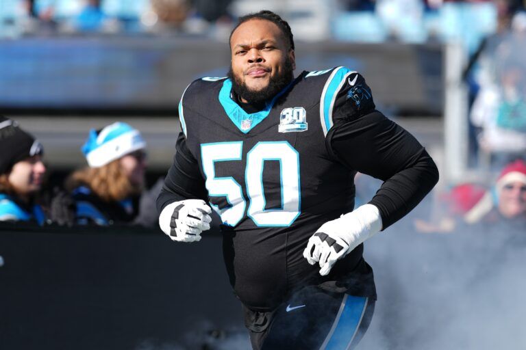 Carolina Panthers guard Robert Hunt (50) takes the field during the first quarter against the Arizona Cardinals at Bank of America Stadium.